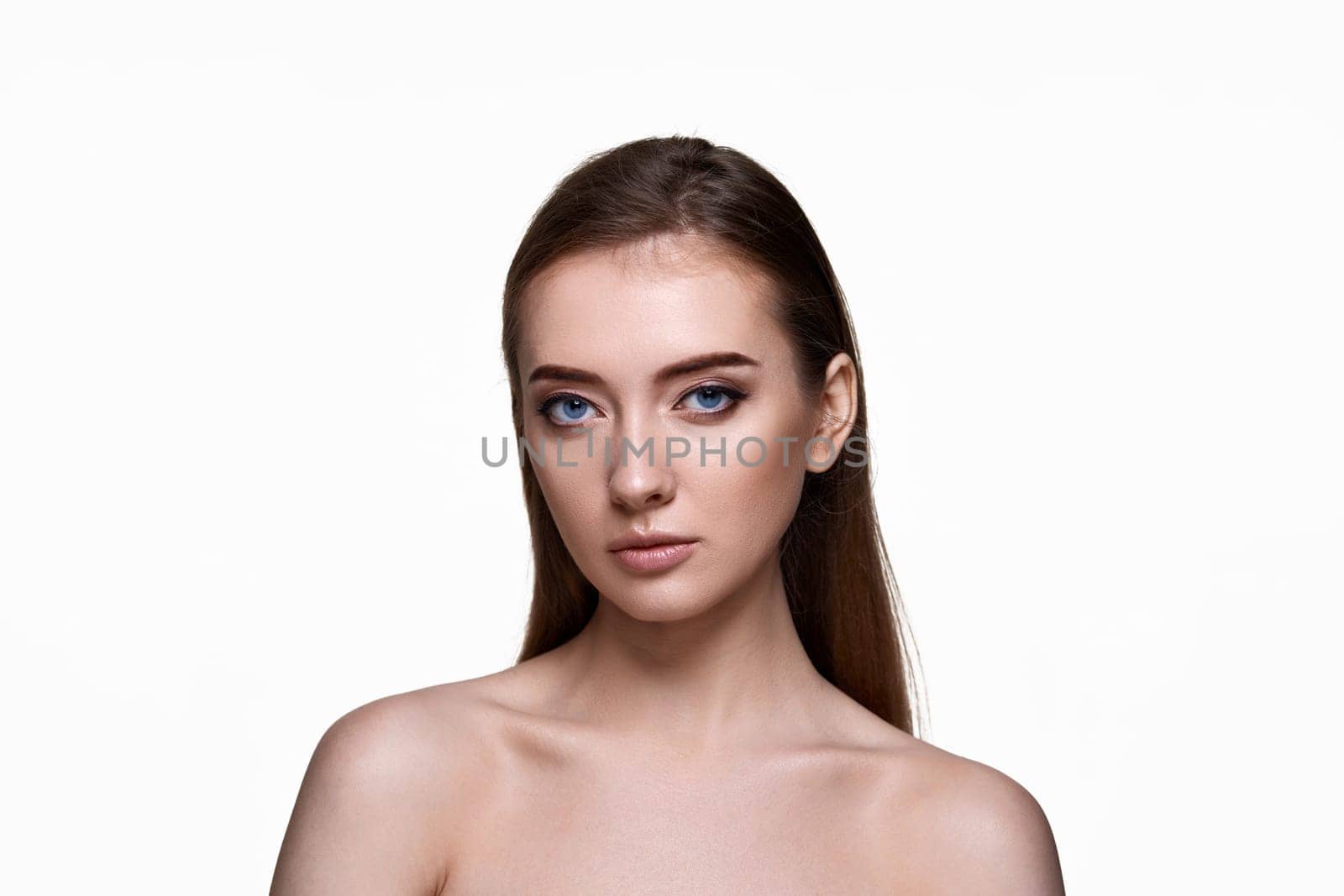 portrait of beautiful young woman with perfect skin on white background. copy space