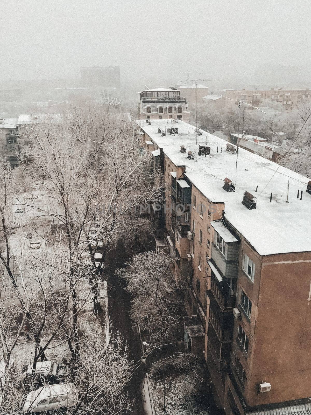 photo view from the window of a multi-storey building on a winter day.