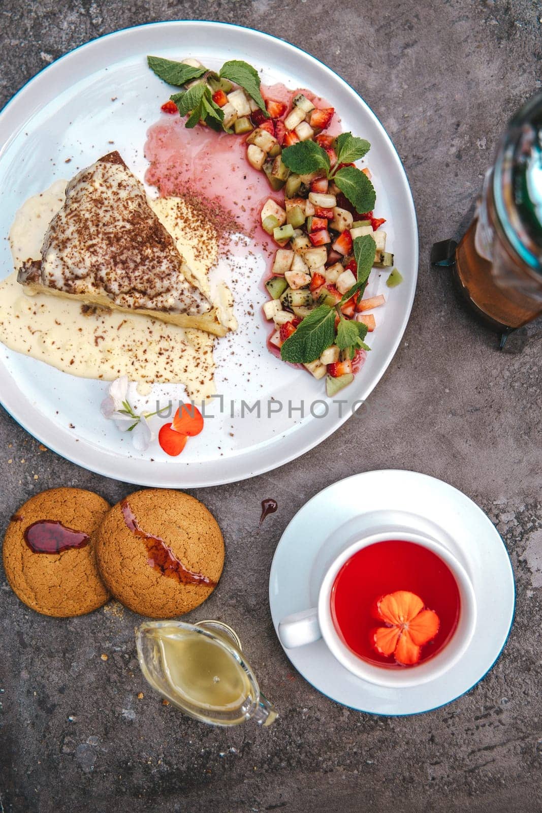 top view of a fresh sponge dessert on a white plate by Pukhovskiy