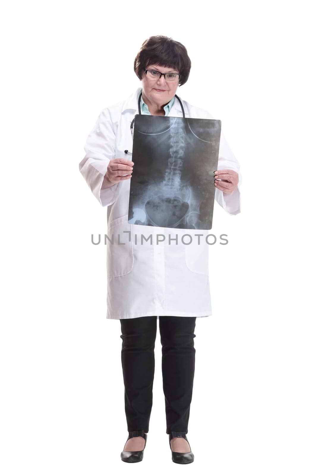 in full growth. senior female doctor with an x-ray. isolated on a white background.