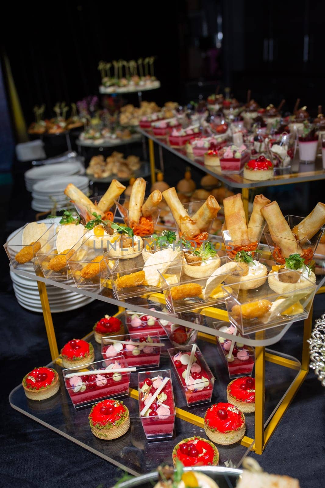 dessert in a plastic basket on the buffet table by Pukhovskiy