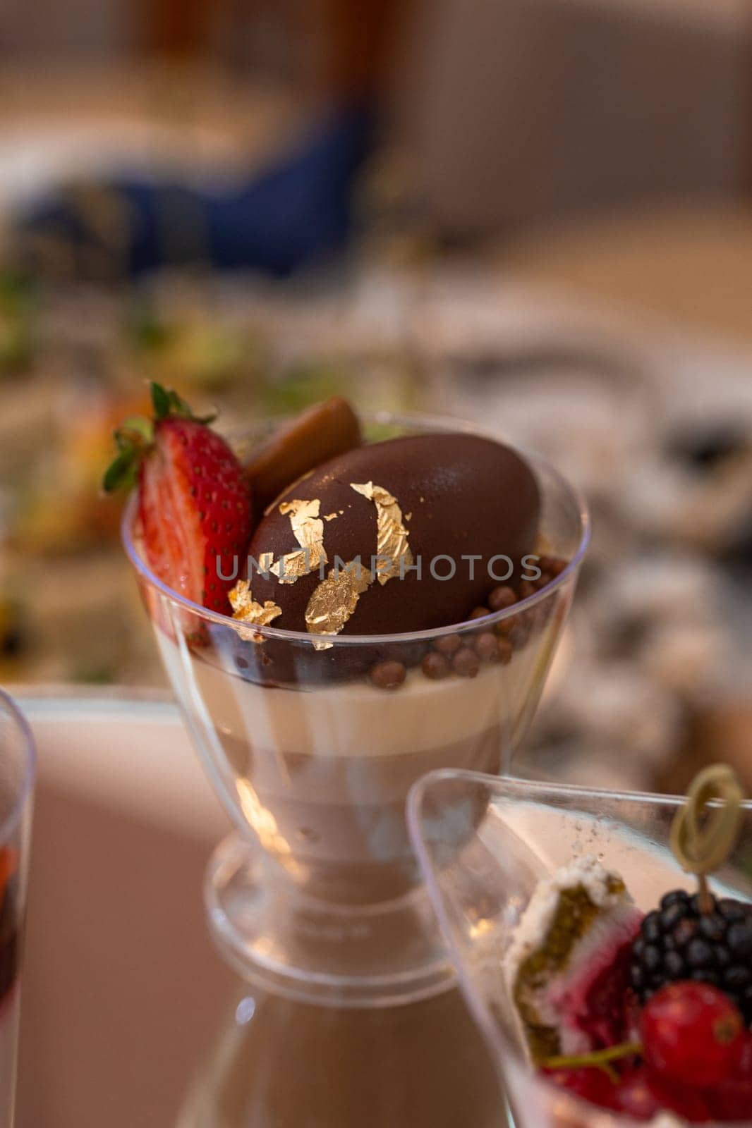 dessert in a plastic basket on the buffet table by Pukhovskiy