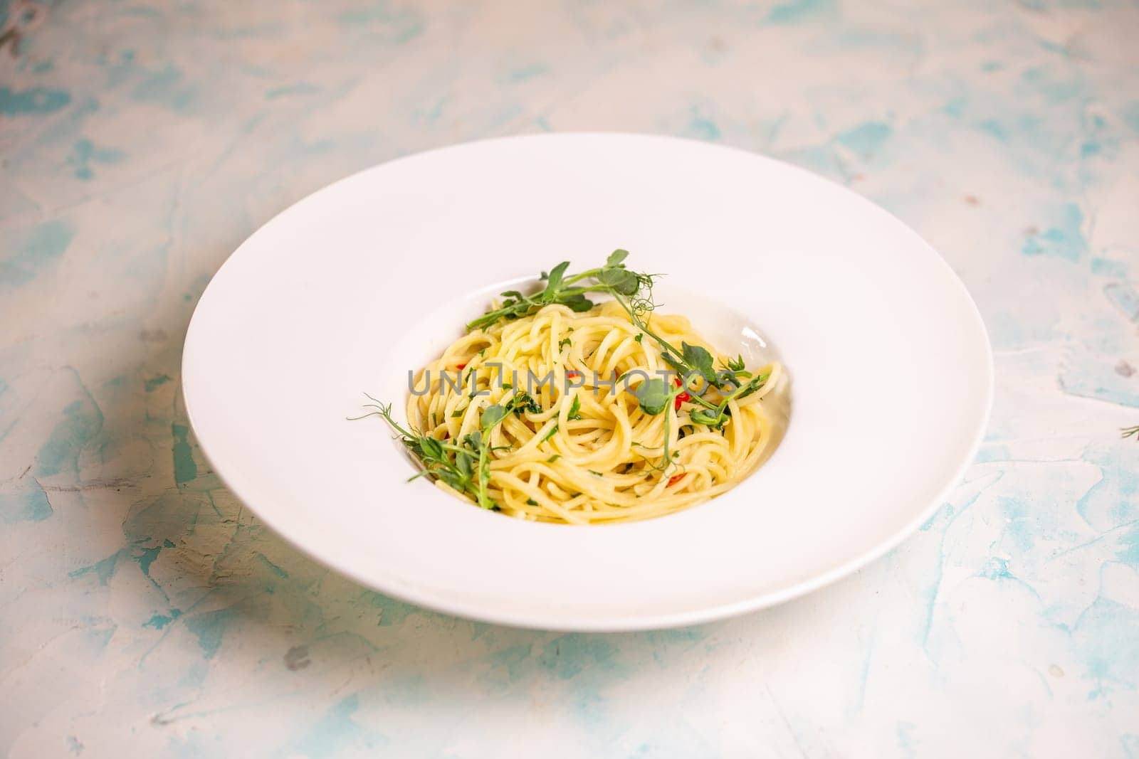 pasta from hard varieties in a white plate.