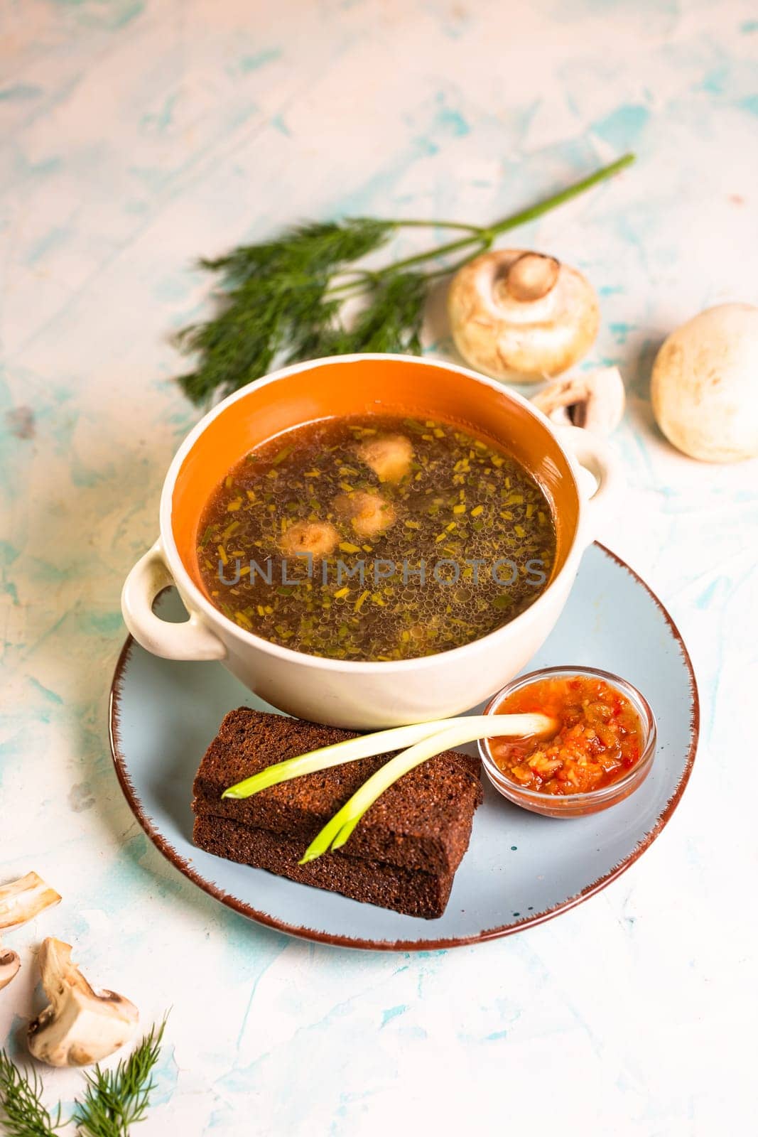 mushroom soup with toast in a cafe on the table.