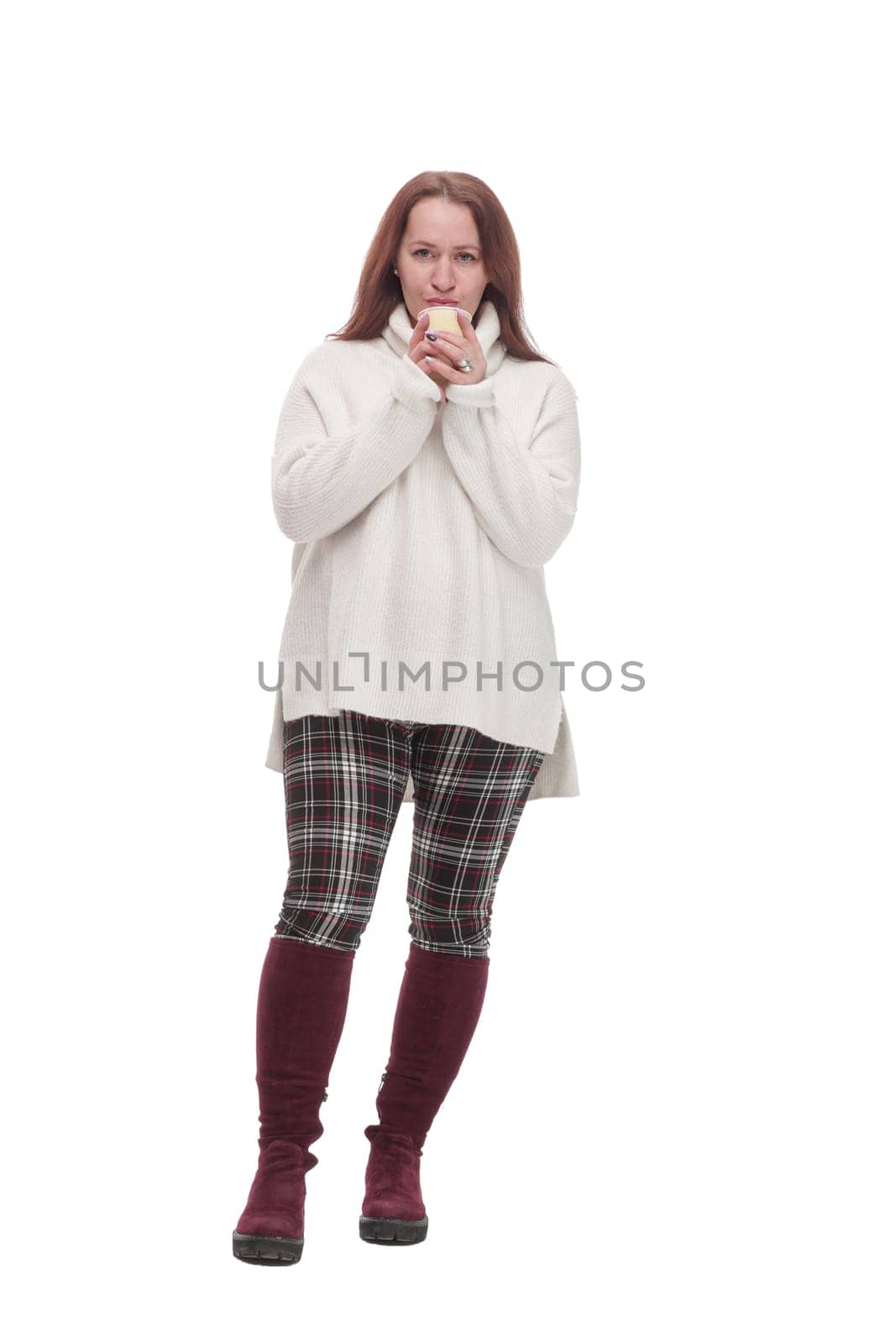 in full growth. casual attractive woman with takeaway coffee.isolated on a white background.