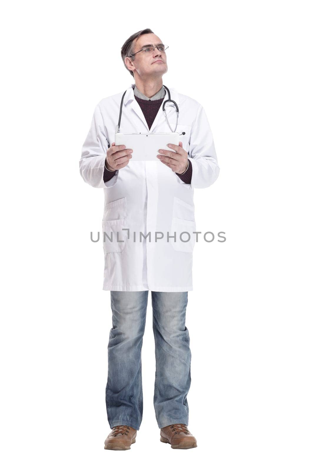 in full growth.qualified doctor with a digital tablet. isolated on a white background.