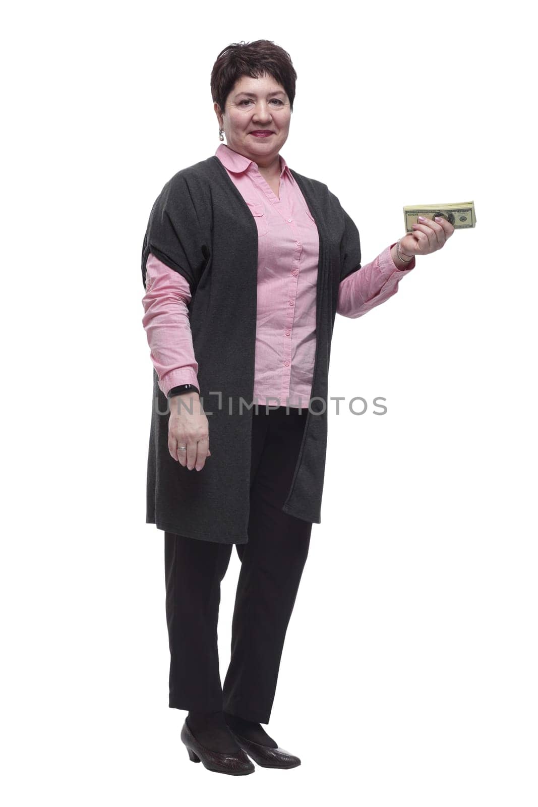 in full growth. adult business woman with cash bills . isolated on a white background