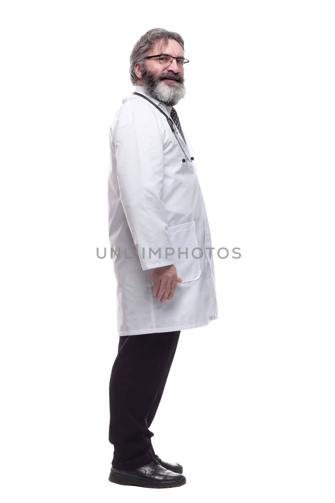 side view. senior male doctor looking at you. isolated on a white background