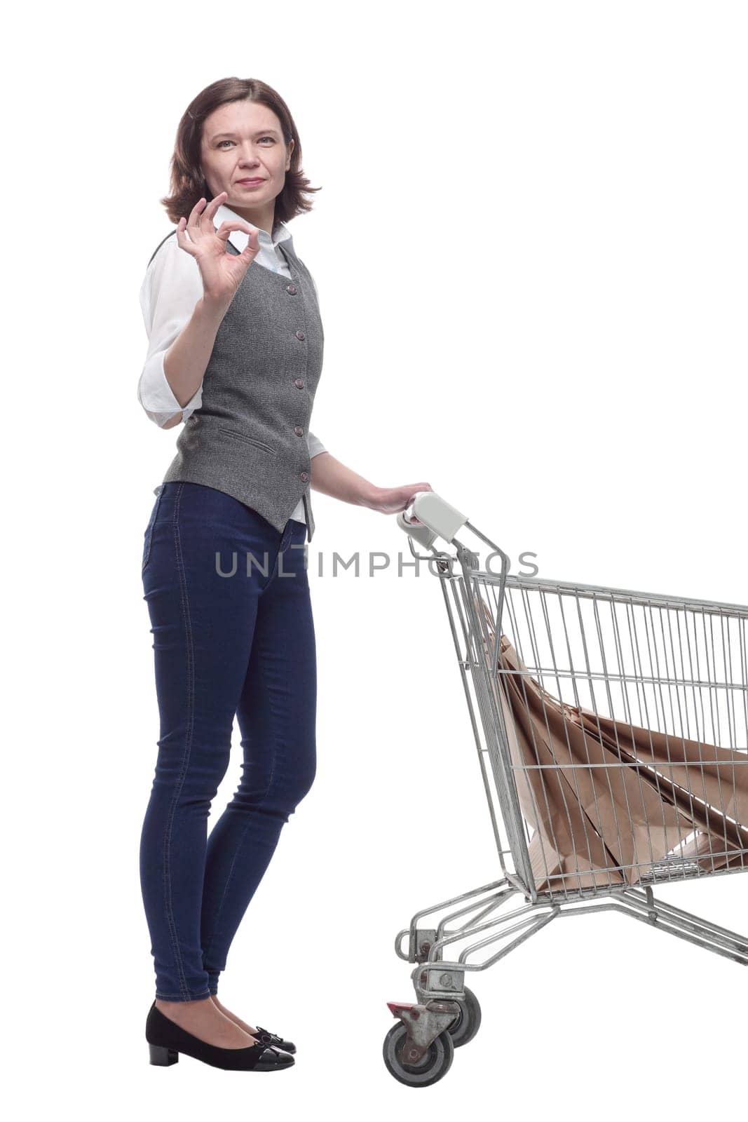 casual mature woman with shopping cart . isolated on a white background.