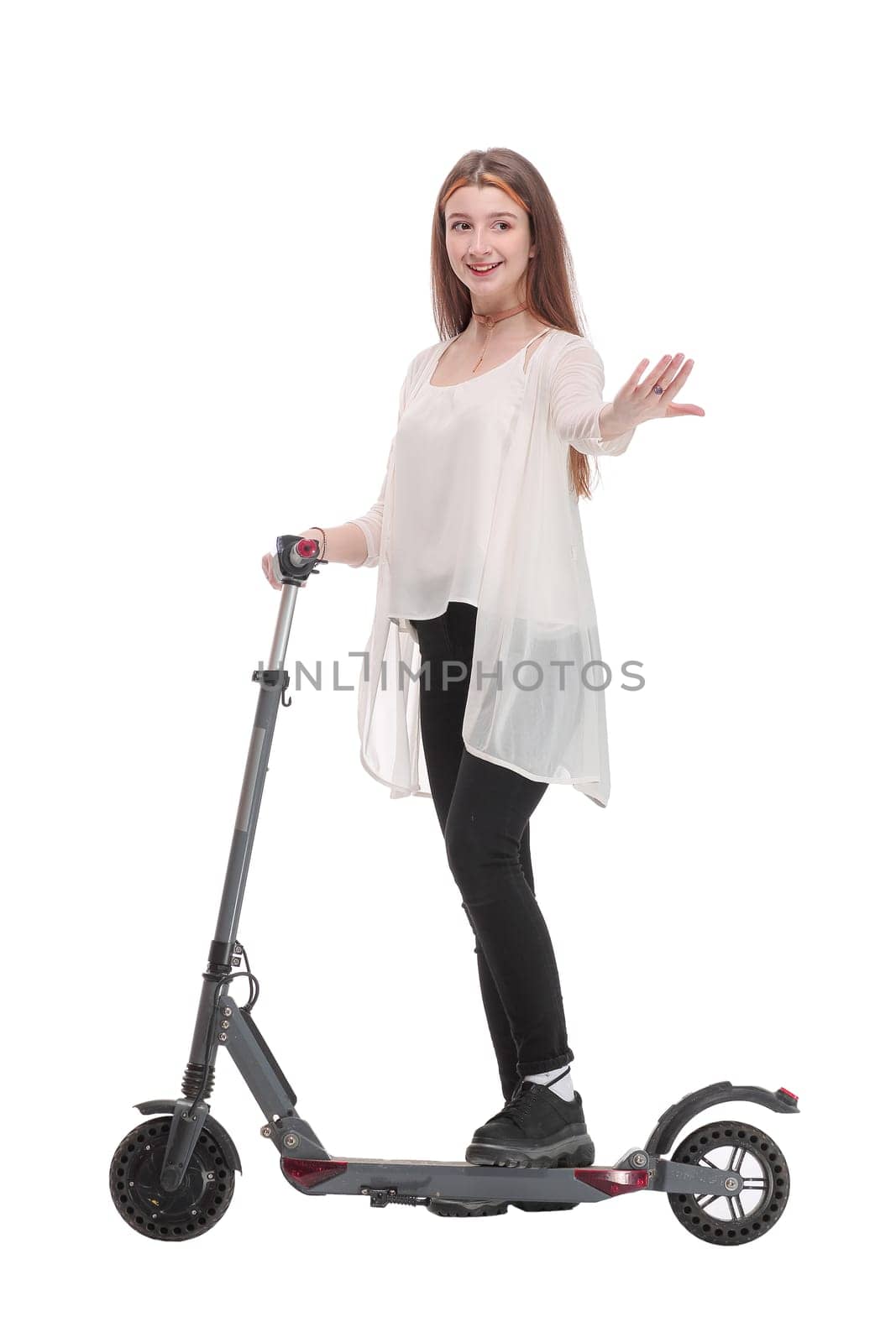 Side view of woman enjoying riding with electric scooter on white background. Concept of healthy lifestyle