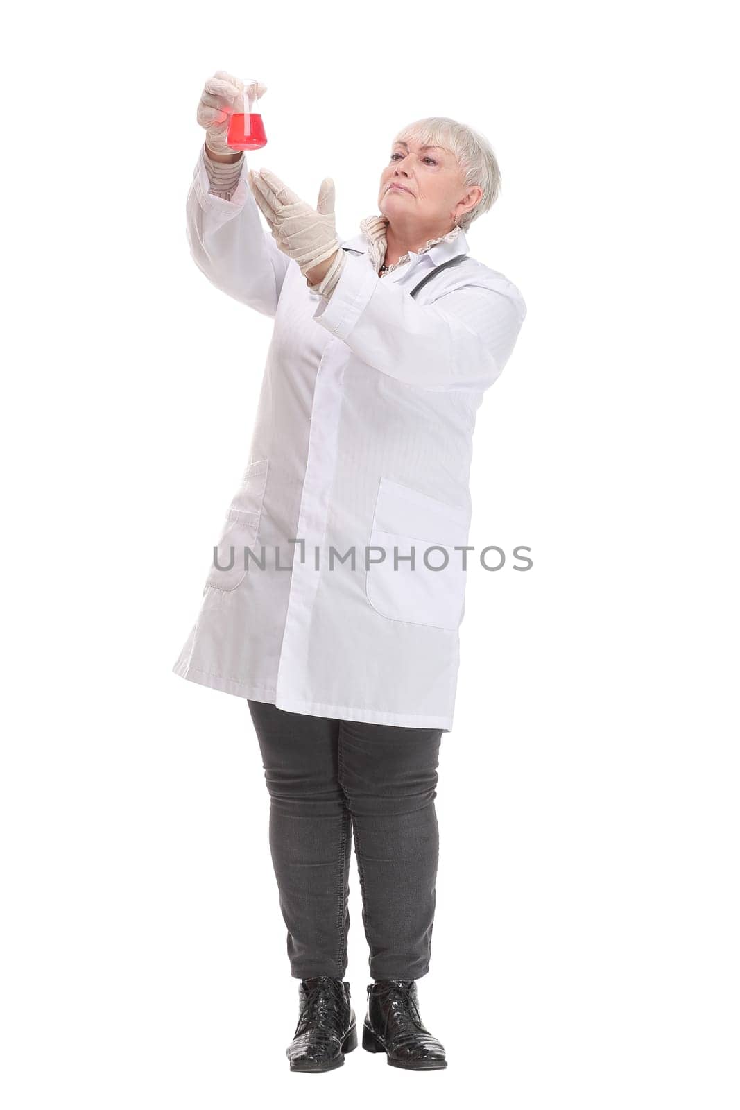 Front view of mature scientist or doctor are testing bloods to prevent and destroy new strains of the virus through tube and beaker. Successful concept