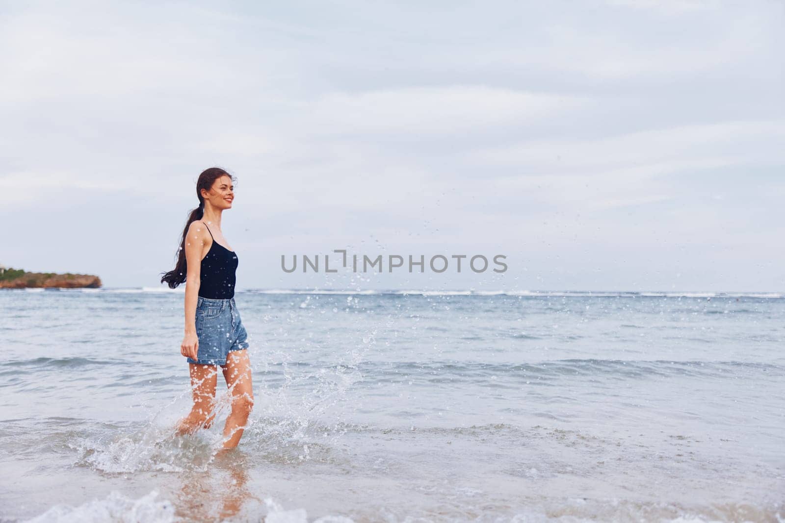 carefree woman sun young lifestyle flight water running smile summer leisure sunset sexy travel body walking shore nature beach girl sea