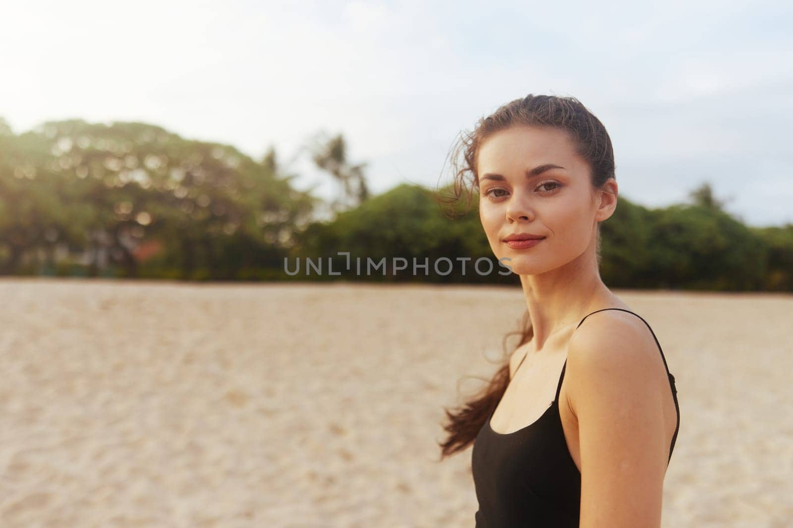 vacation woman adult water sunlight holiday outdoor smile young female summer sea ocean sand freedom copy-space beach tropical coast lifestyle sunset