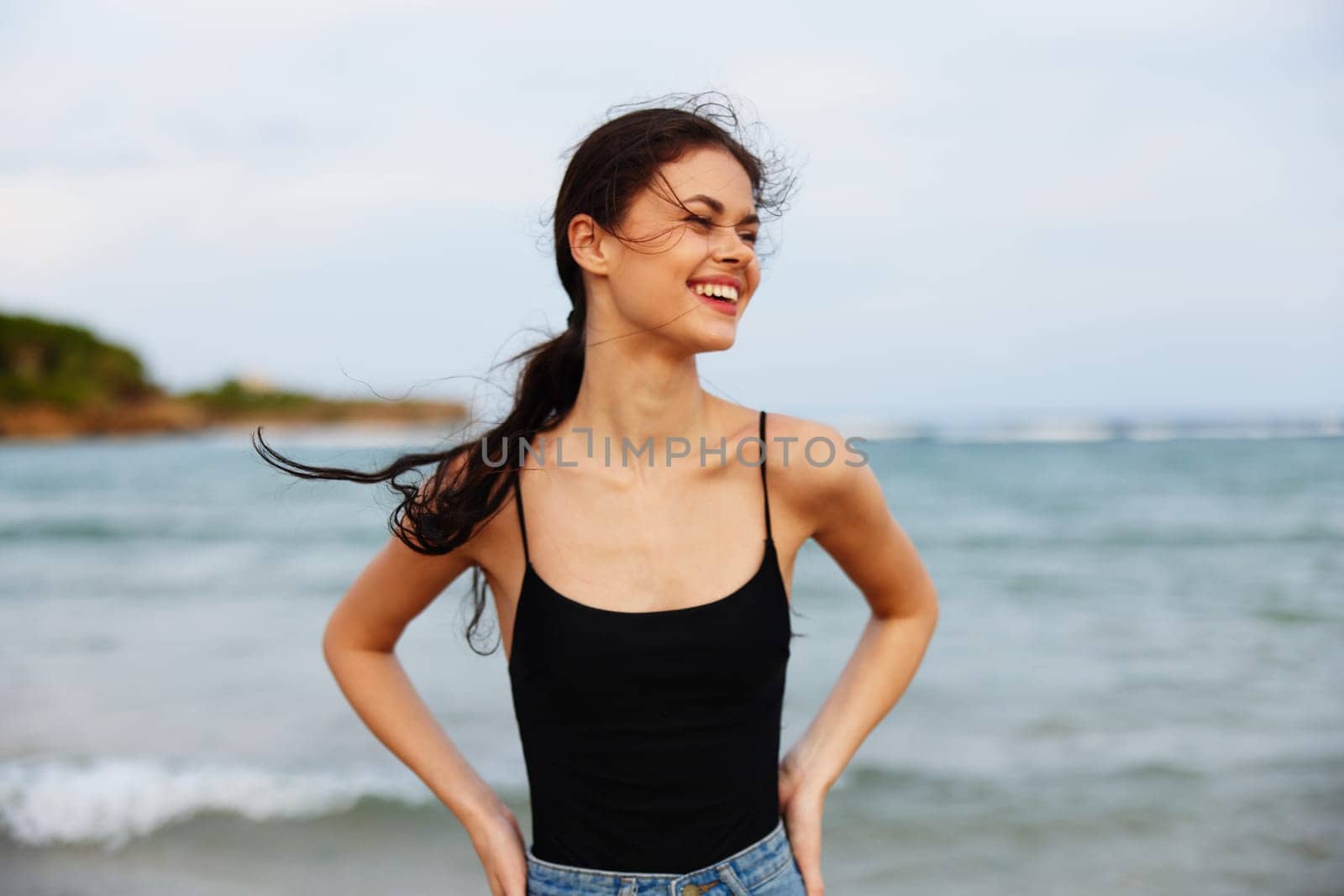 vacation woman young holiday shore hair leisure beach sea sunset running sand smile lifestyle ocean summer tropical smiling long beautiful sun happy