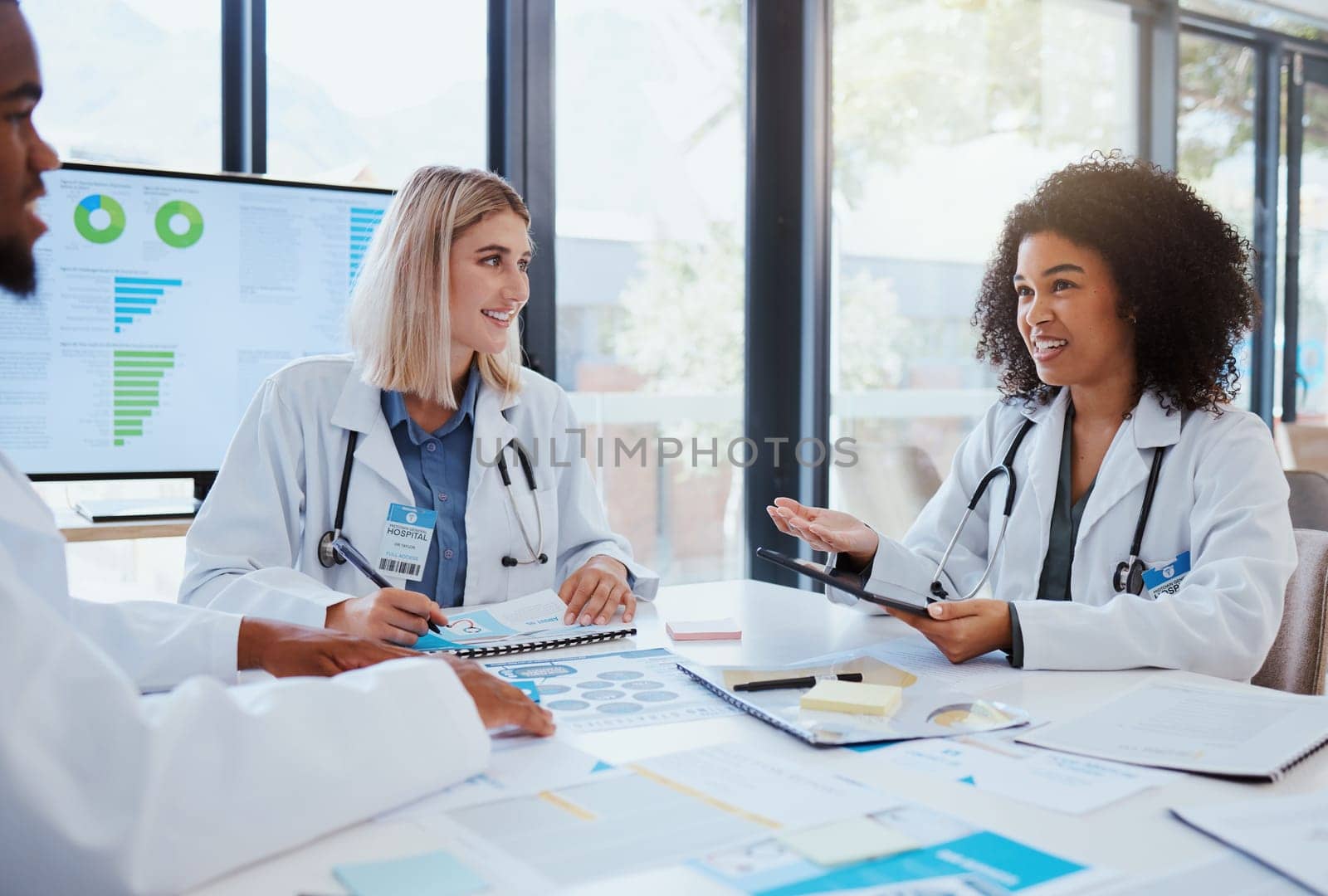 Healthcare, meeting and teamwork with a doctor and her team planning for growth, research and innovation in the medical industry. Collaboration, medicine and communication with a woman surgeon by YuriArcurs