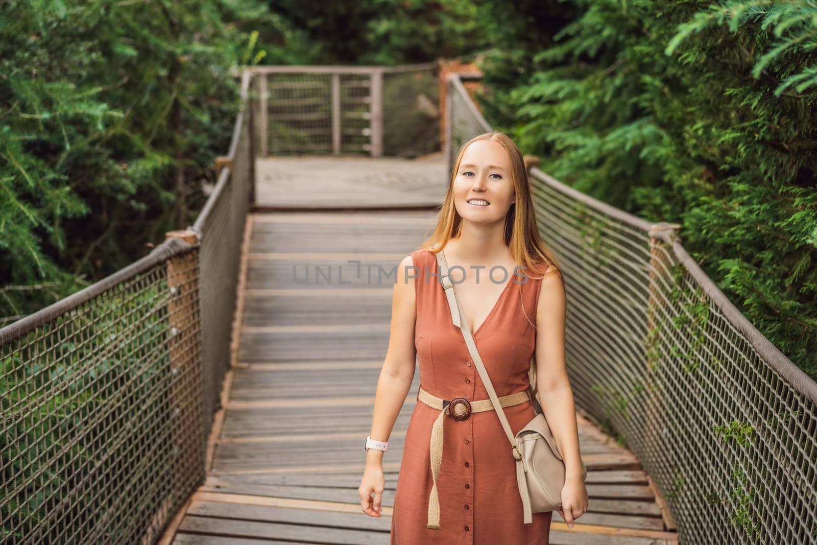Woman tourist in Rope bridge in Yildiz Park. Besiktas, Istanbul, Turkey. Turkiye.