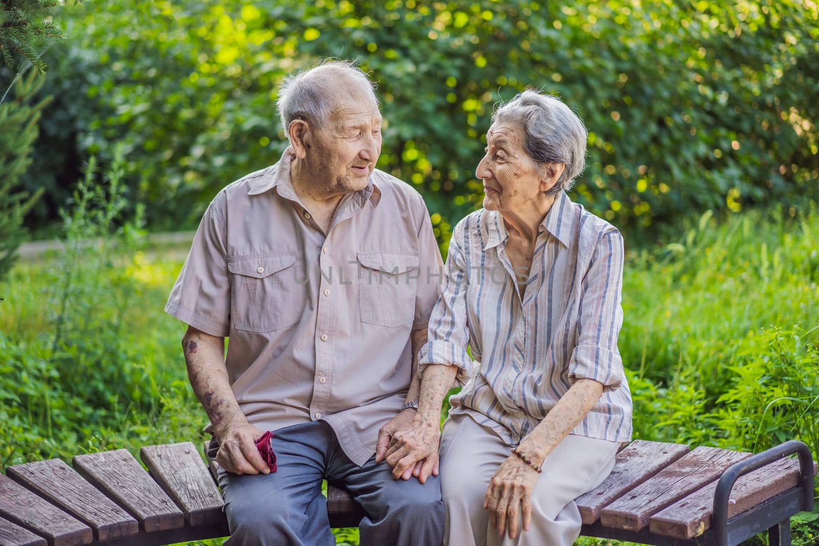 Elderly couple in love. Senior husband and wife holding hands and bonding with true emotions.