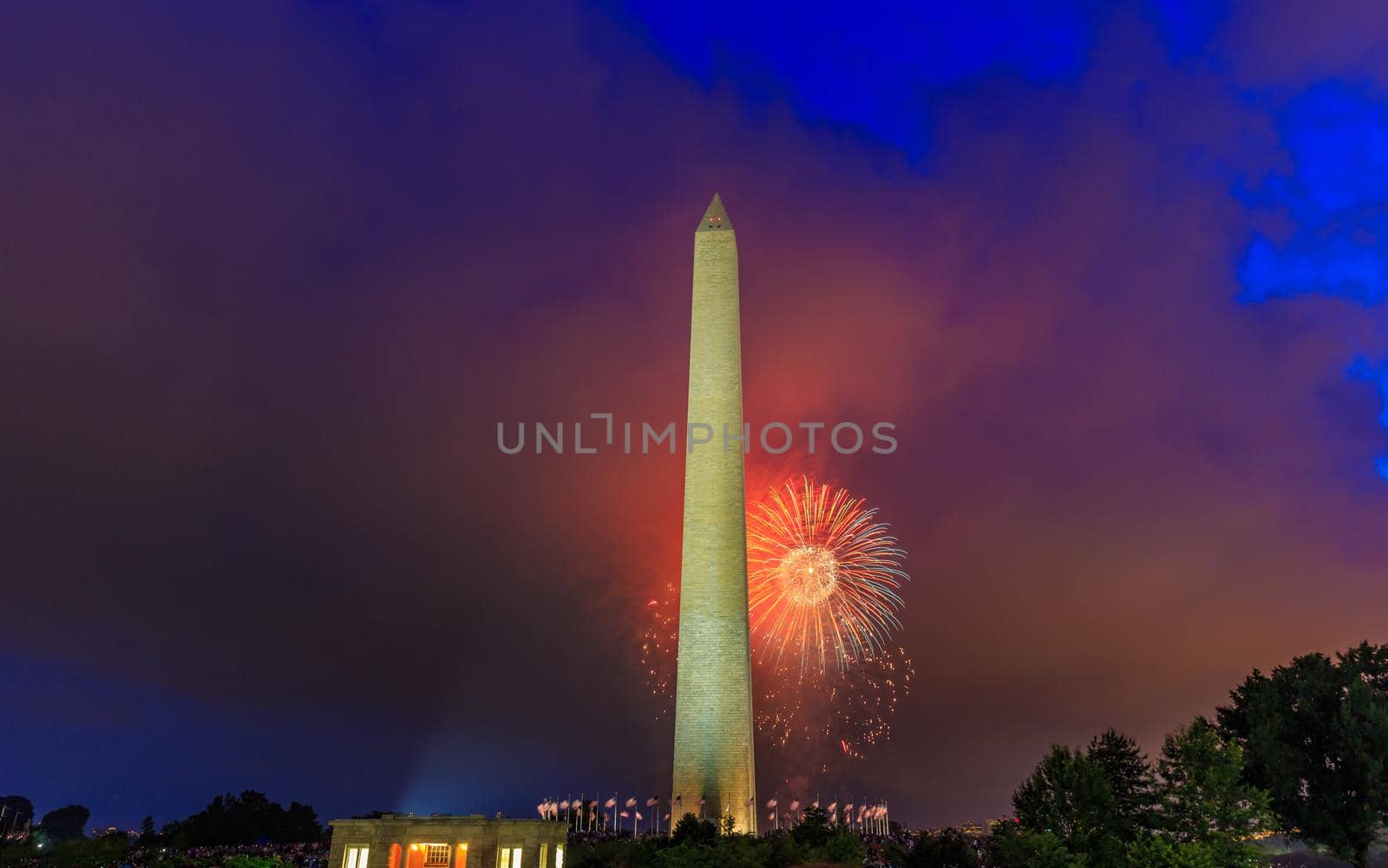 Washington DC, USA - July 04, 2015: Washington Monument stands tall with Fourth of July Fireworks in background.