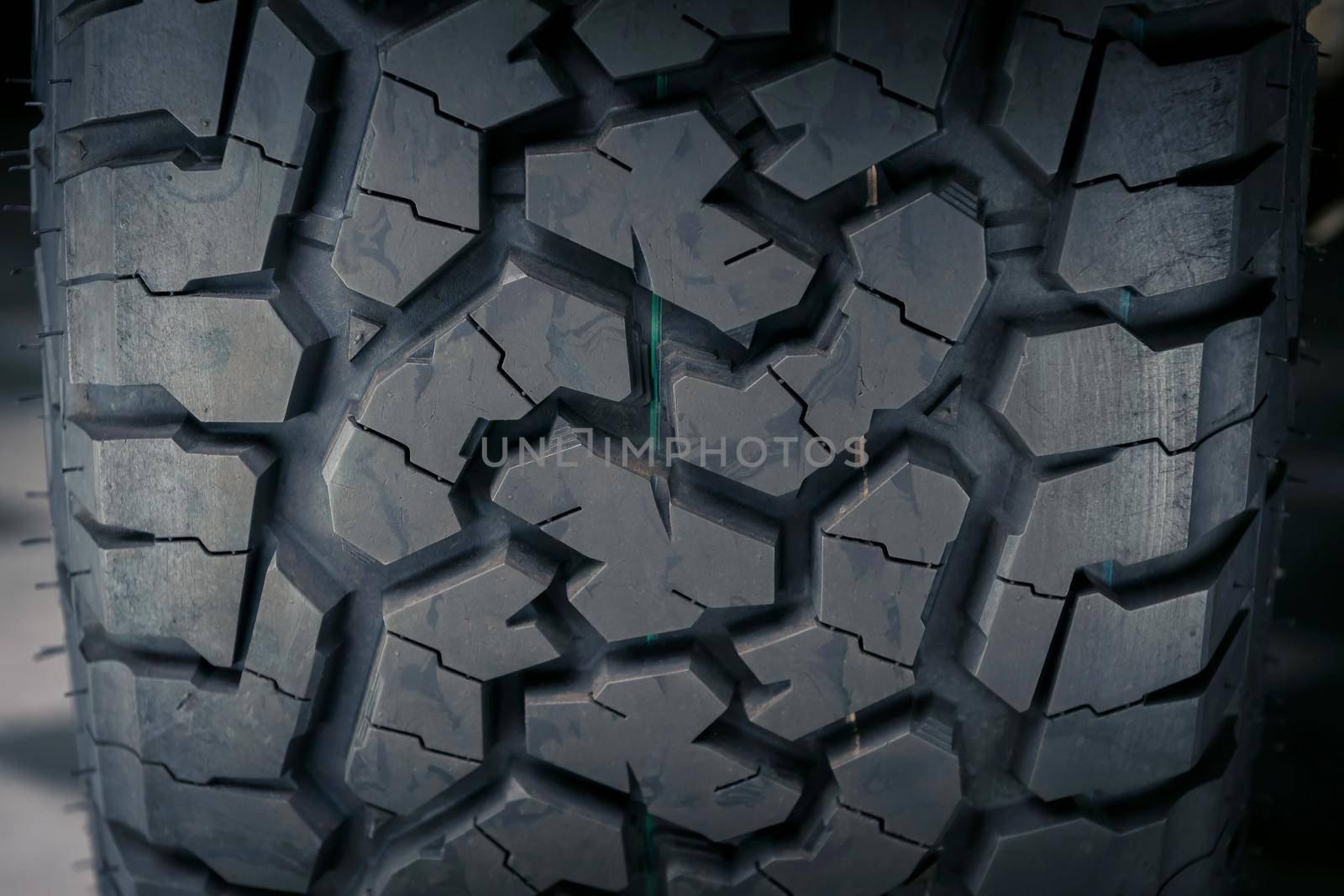 Close-up of all terrain tire patterns and textures, use for abstract background and transportation concepts.
