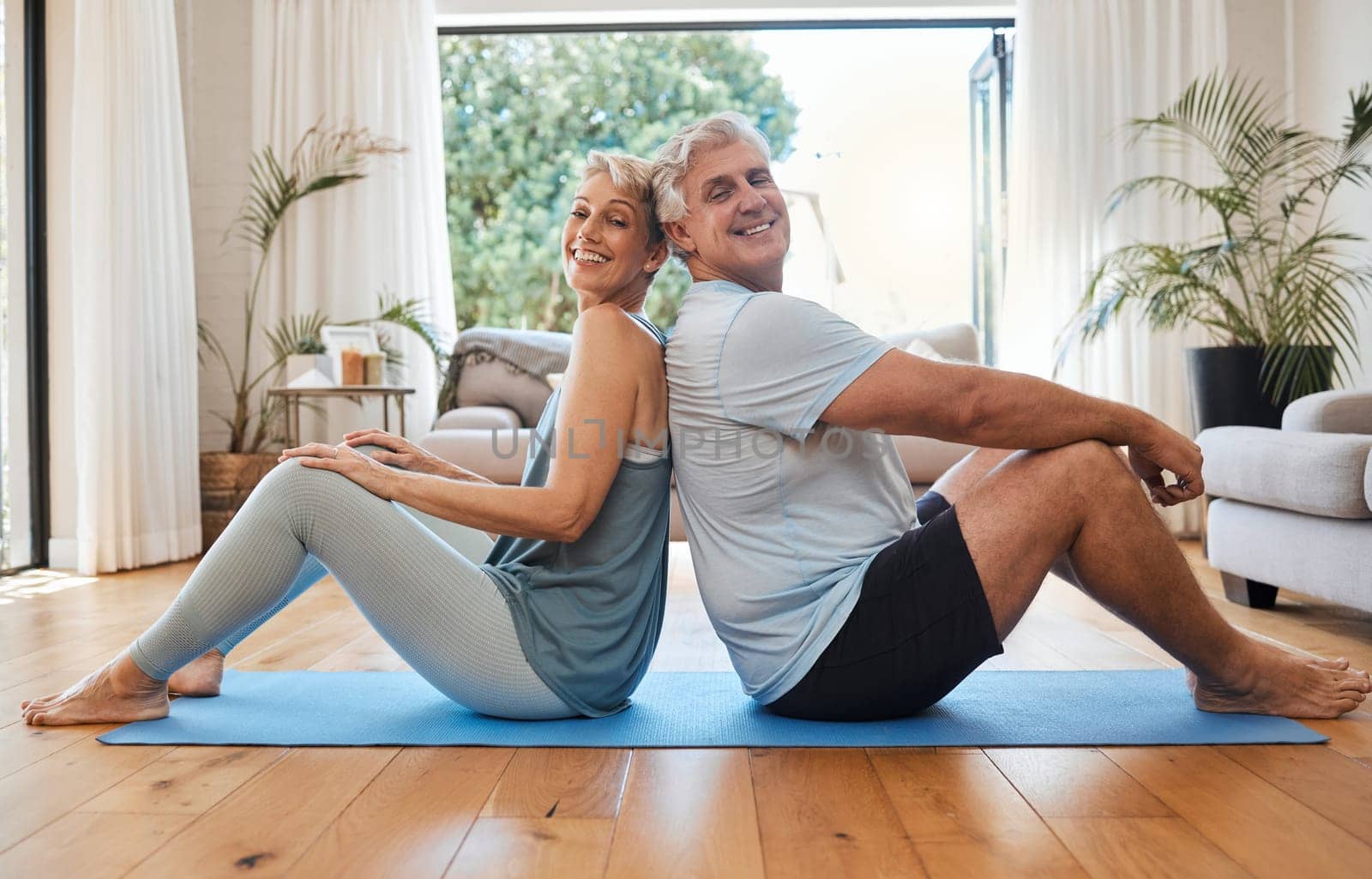 Health, senior couple and doing yoga, meditation and smile for wellness, fitness and workout on yoga mat together. Retirement, happy man and woman exercise, training and healthy in house on floor. by YuriArcurs