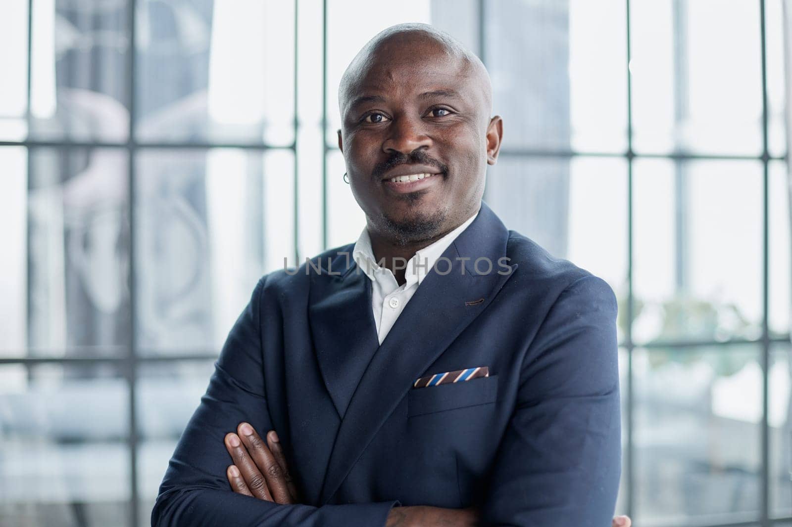 Handsome african american executive businessman in the office close up