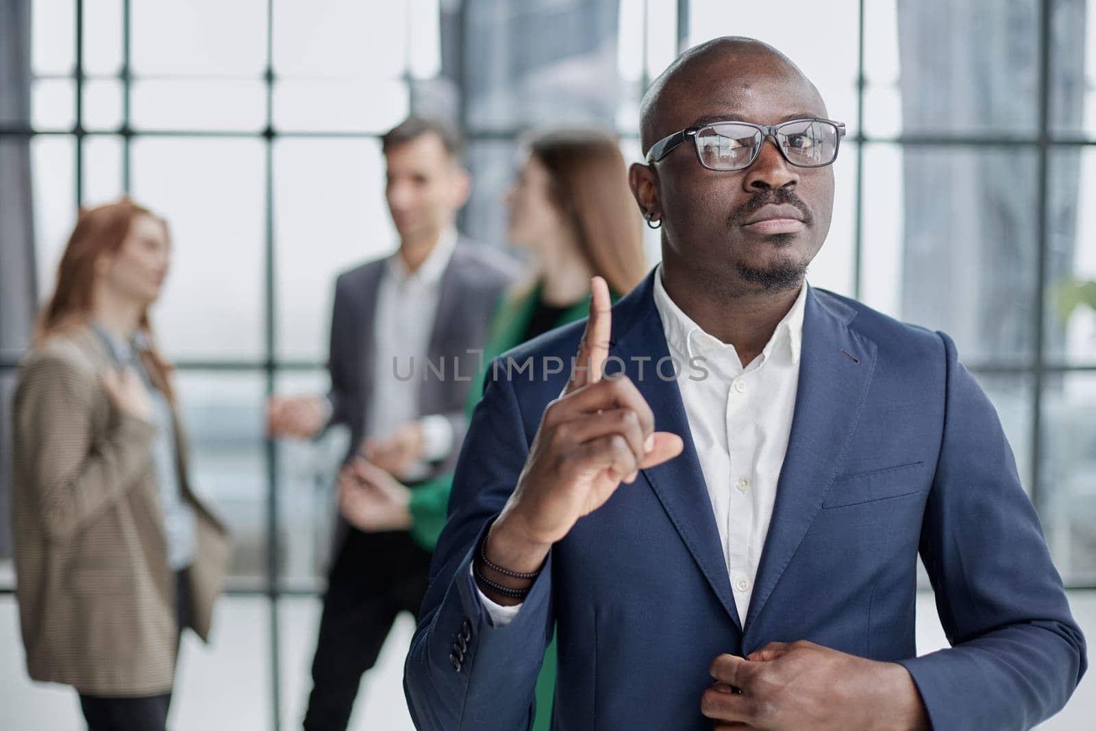 Handsome african american executive businessman in the office close up