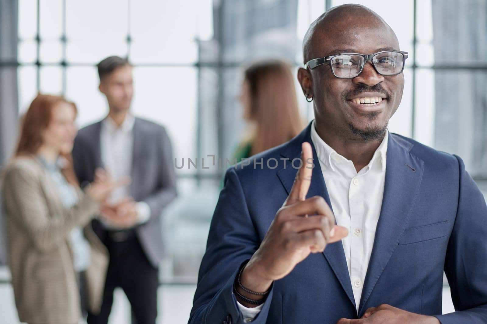 Handsome african american executive businessman in the office close up