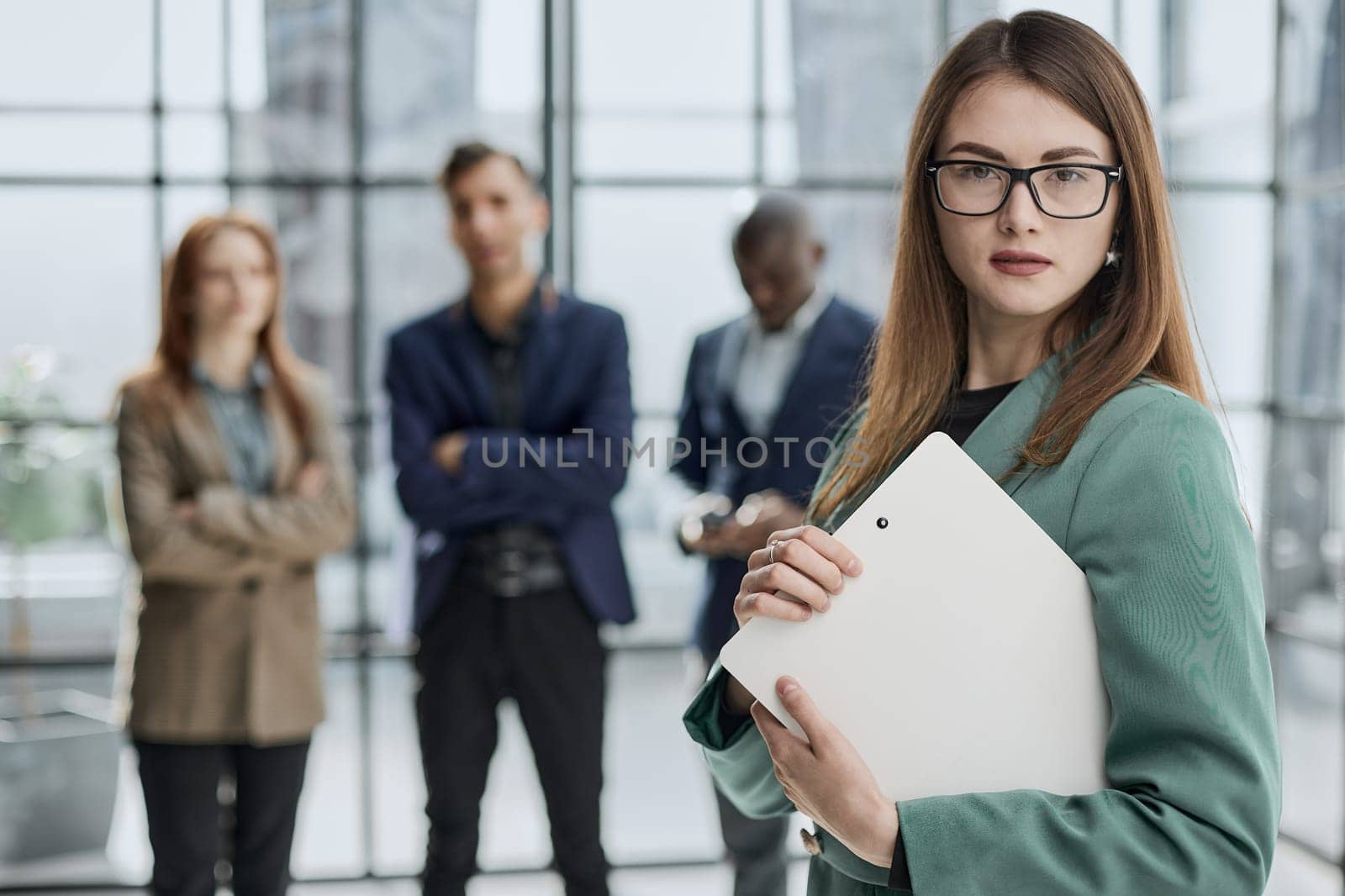 executive manager employer introducing welcoming newcomer to workmates.