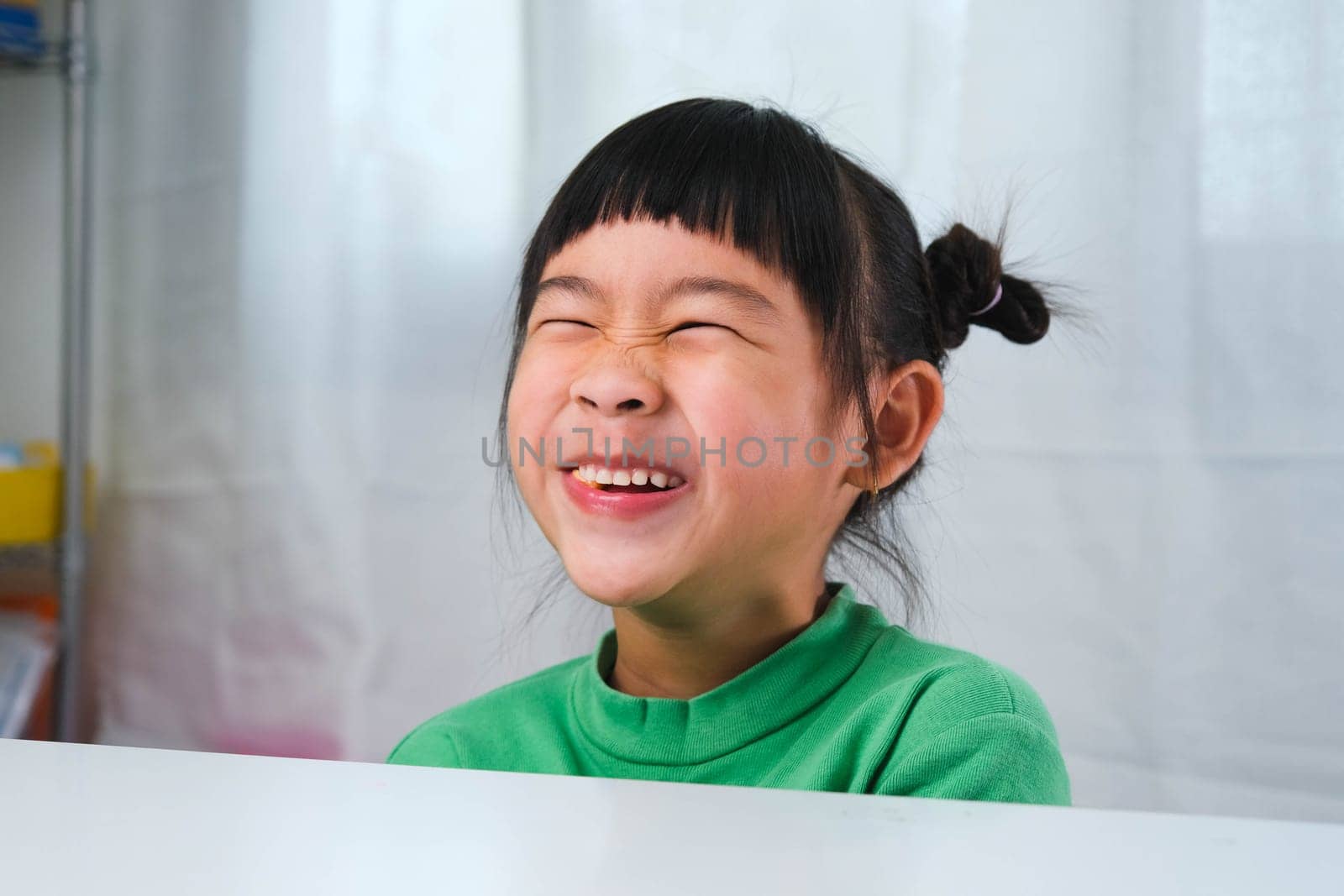 Happy cute little girl eating gelatin candy. Funny kid with chewing gum. Beautiful little girl with with vitamins for children like jelly candy. by TEERASAK