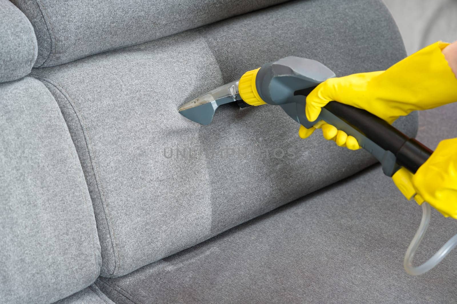 Sofa before and after wet - cleaning indoors. textile sofa vacuum cleaning. professional cleaning service concept.