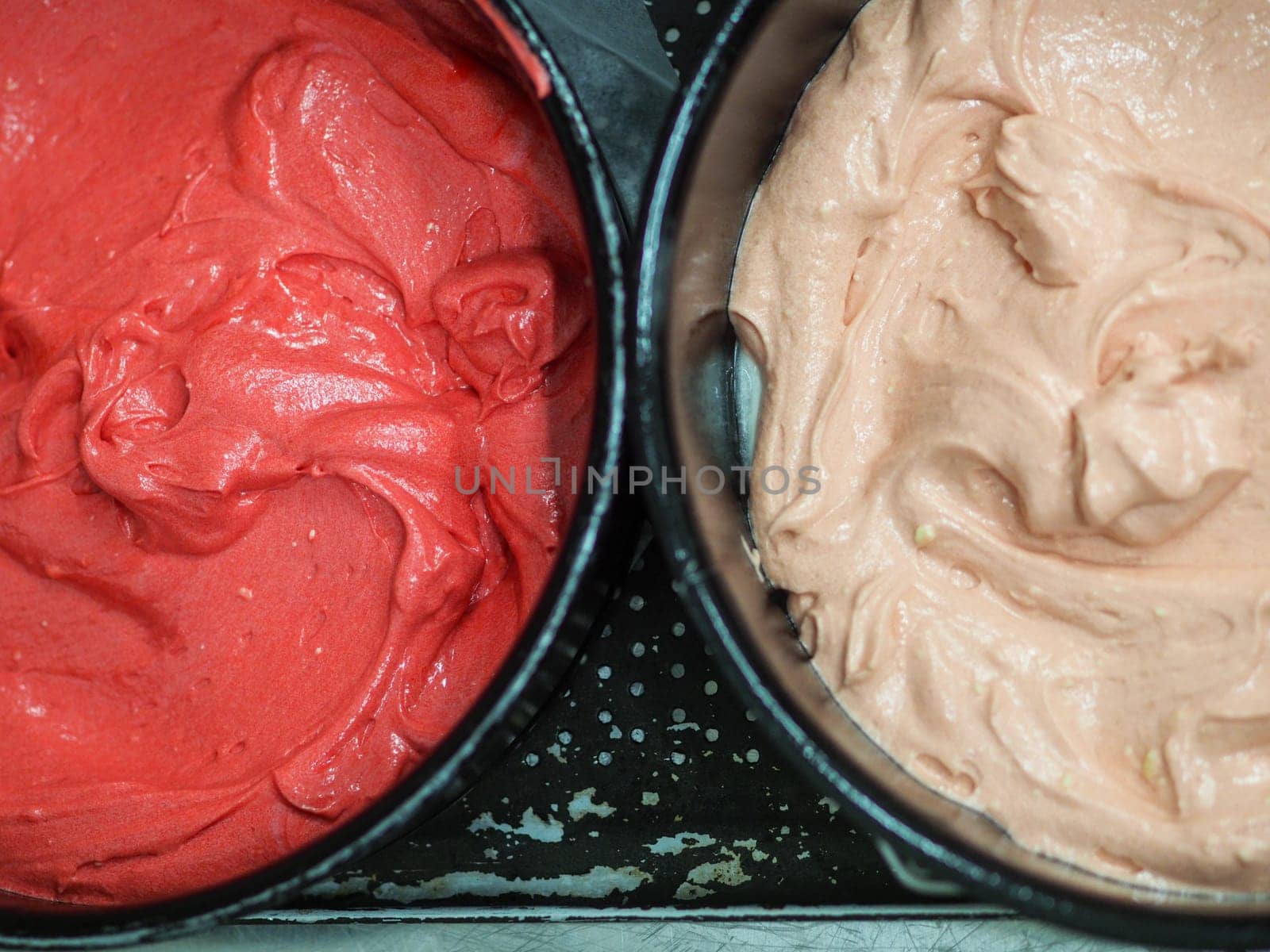 chef preparing white pink red cake creamy mixtures doughs to bake in the oven