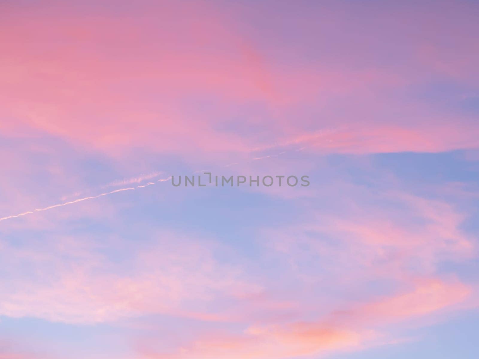 Fresh air, weather concept. Soft, fluffy and colorful cloud formation. Abstract idyllic pink and blue sky. Blur background texture of colorful sunset clouds. Twilight sky.
