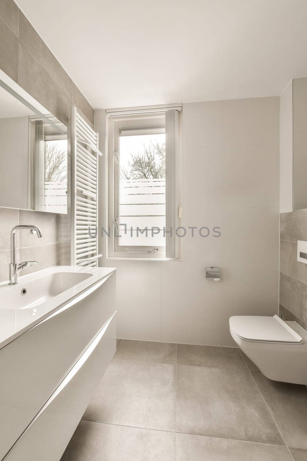 a bathroom with a sink toilet and a window by casamedia