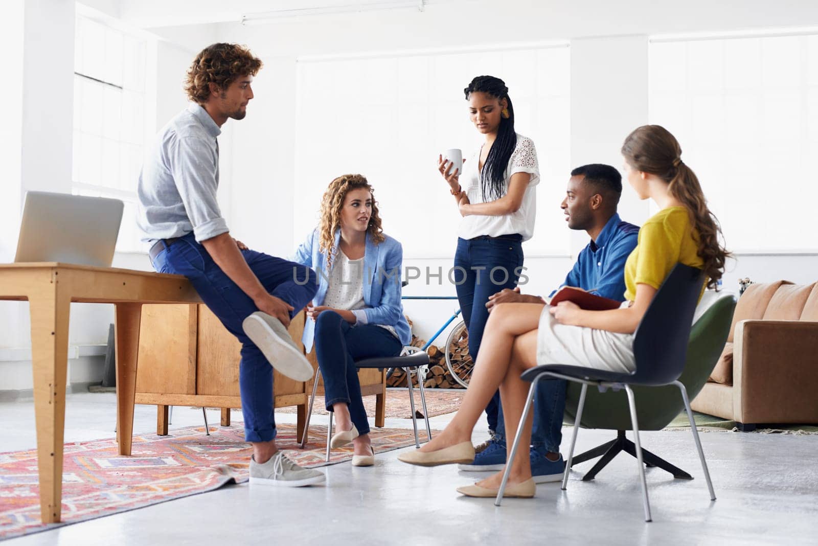 Young people chatting in the office.