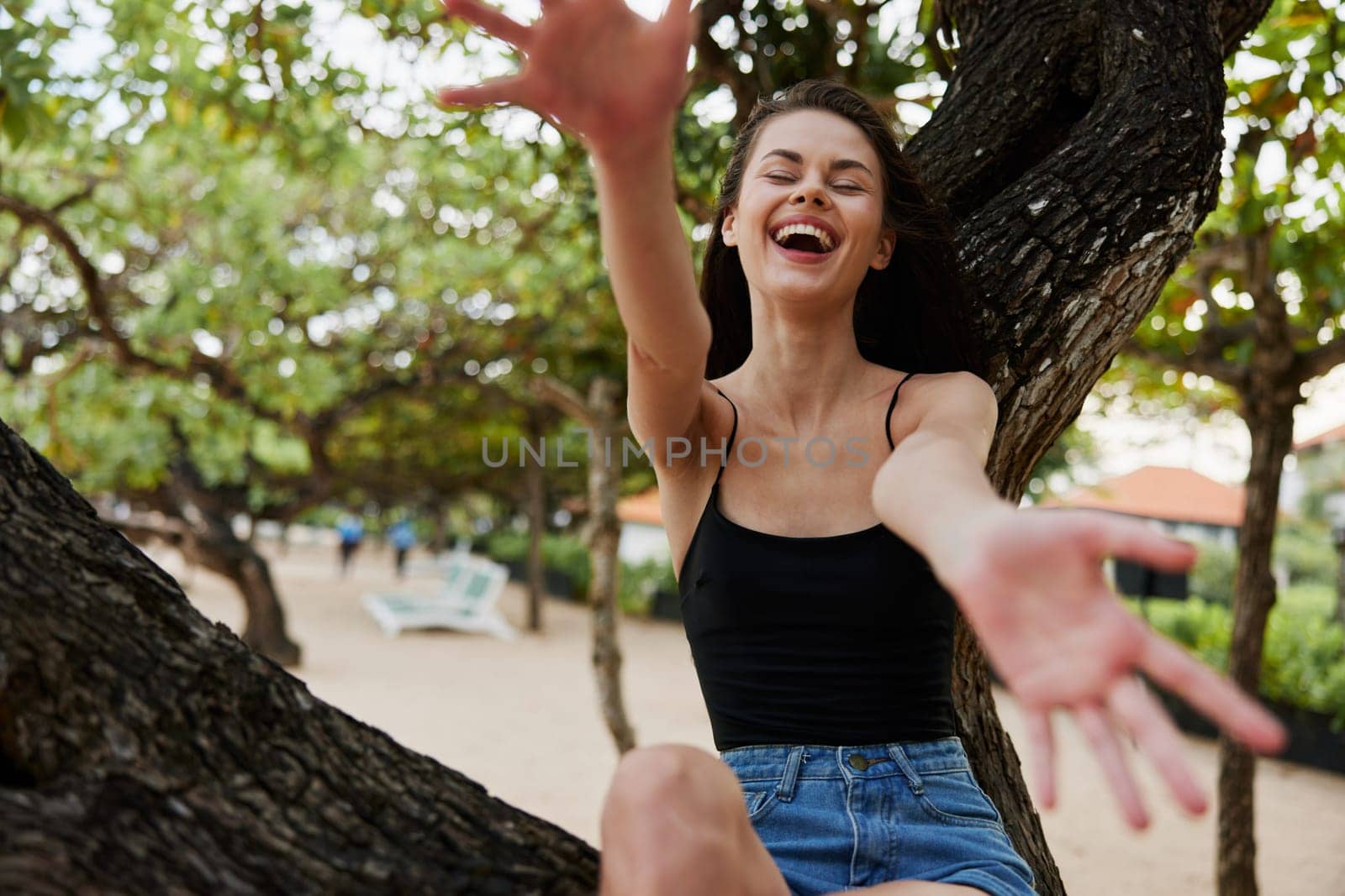 woman girl outdoors sunny relaxation lifestyle alone freedom long palm hair nature sunset vacation beach hill sitting sky tree sea smiling relax