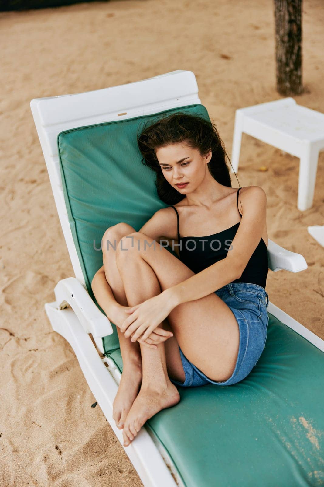 resort woman ocean sunbed lying sand smiling beach lifestyle sea sitting by SHOTPRIME
