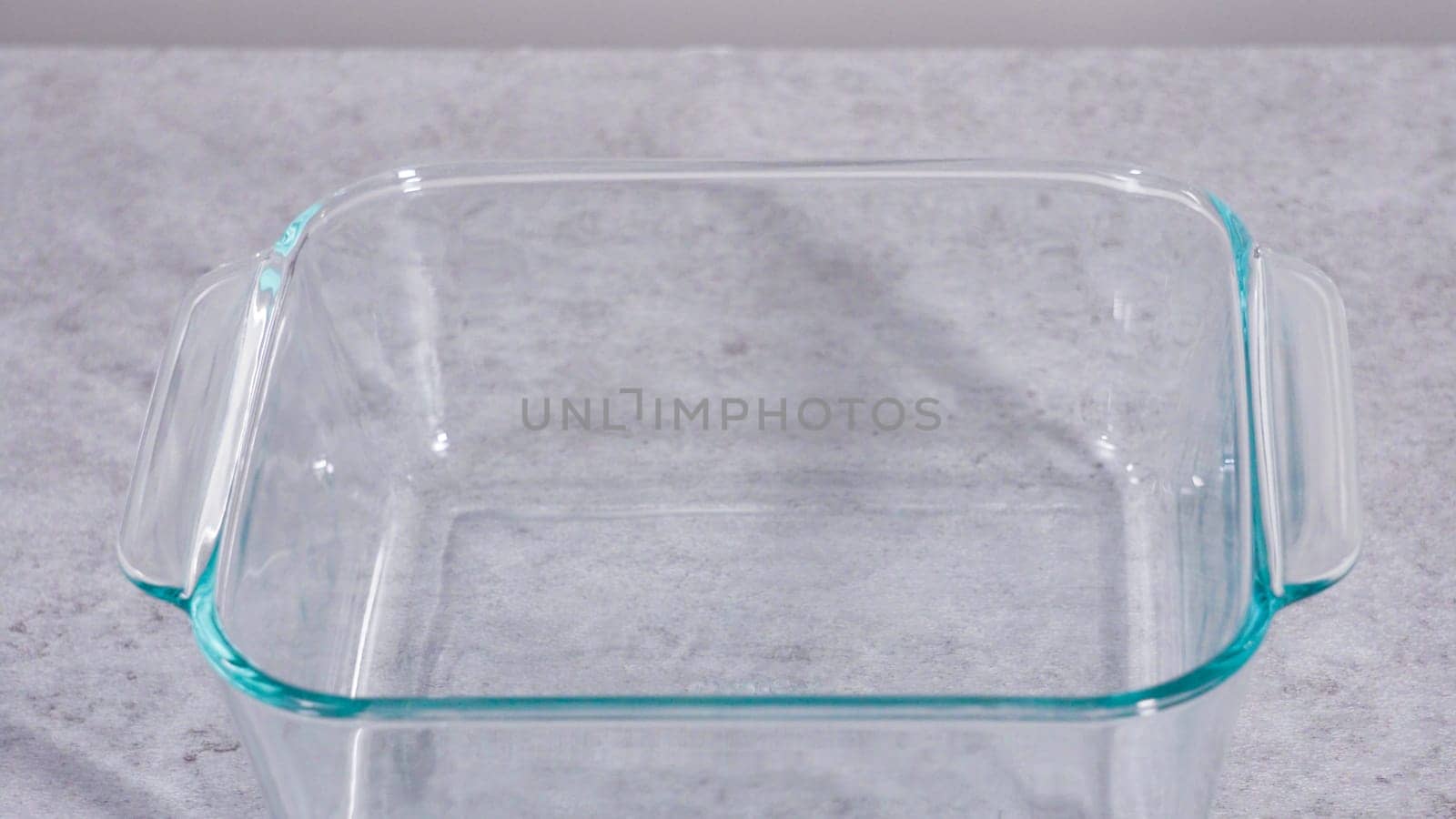 Empty square glass baking dish on the kitchen counter.