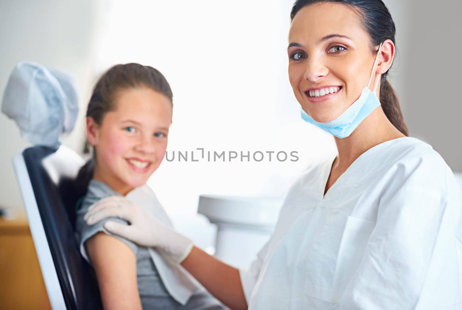 Shes my best little brusher. Portrait of a female dentist and child in a dentist office