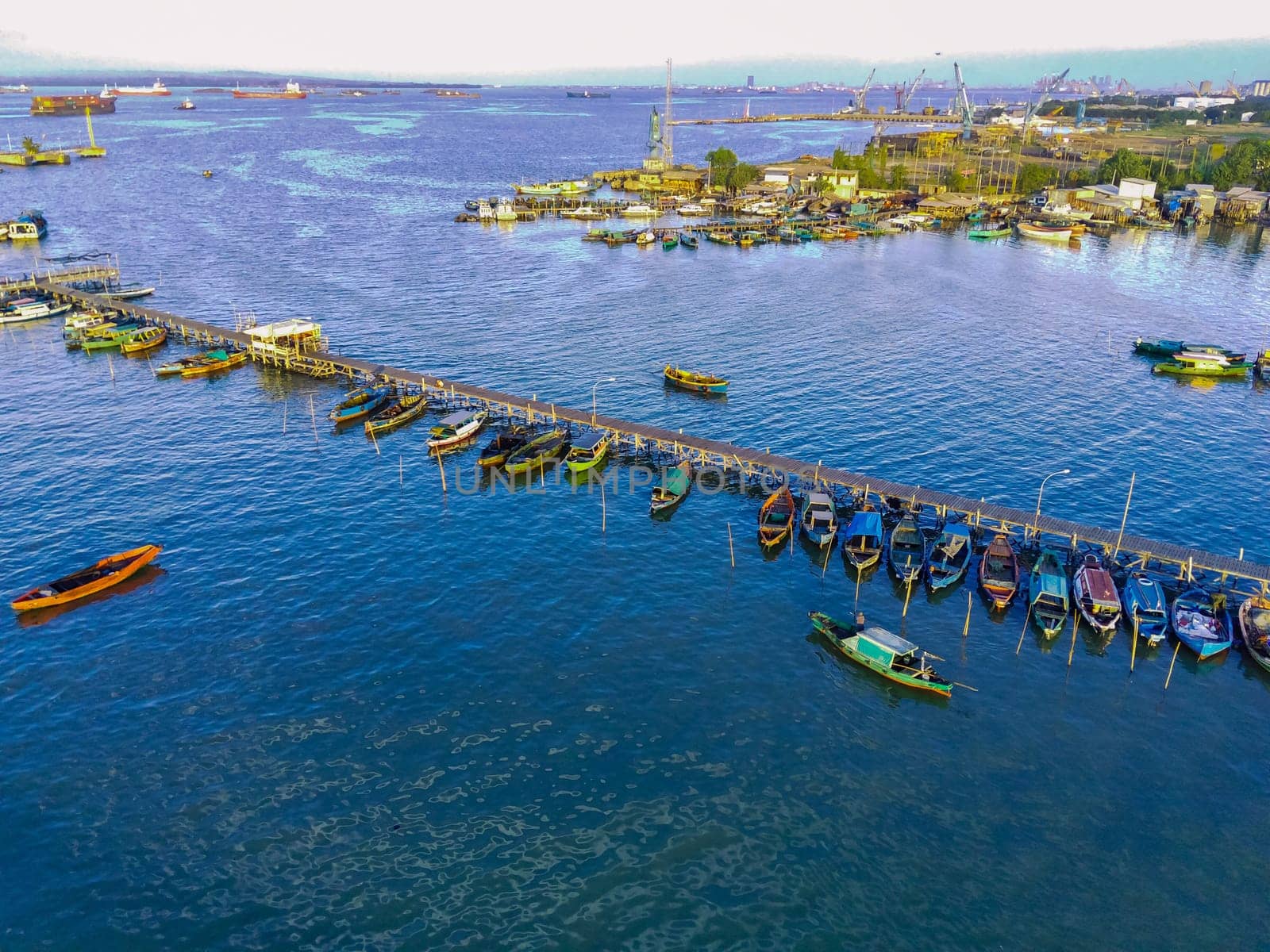 Aerial top down on traditional colourful asian fisherman boats moored in Gresik, Indonesia. Drone Photography. Aerial Photography.