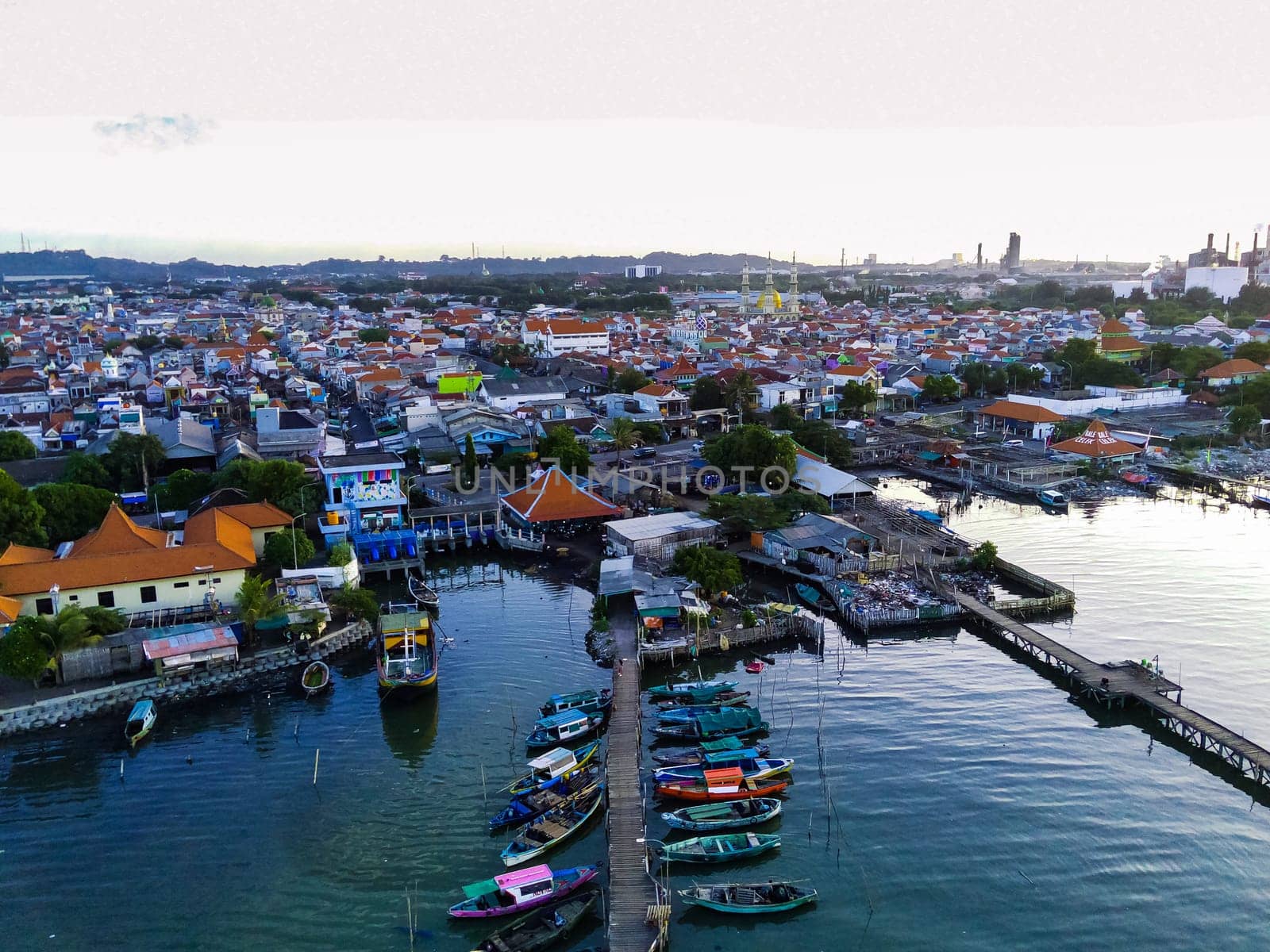 Aerial top down on traditional colourful asian fisherman boats moored in Gresik, Indonesia. Drone Photography. Aerial Photography.
