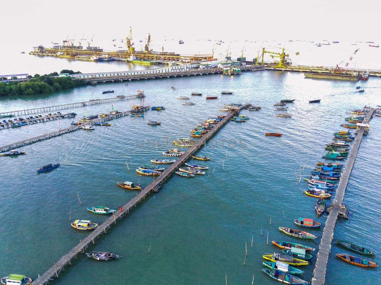 Aerial top down on traditional colourful asian fisherman boats moored in Gresik, Indonesia. Drone Photography. Aerial Photography.