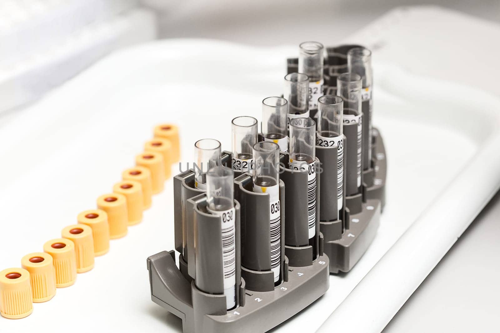 A chemical sample bottle. Centrifuge. A test tube vial sets for analysis. Medical research