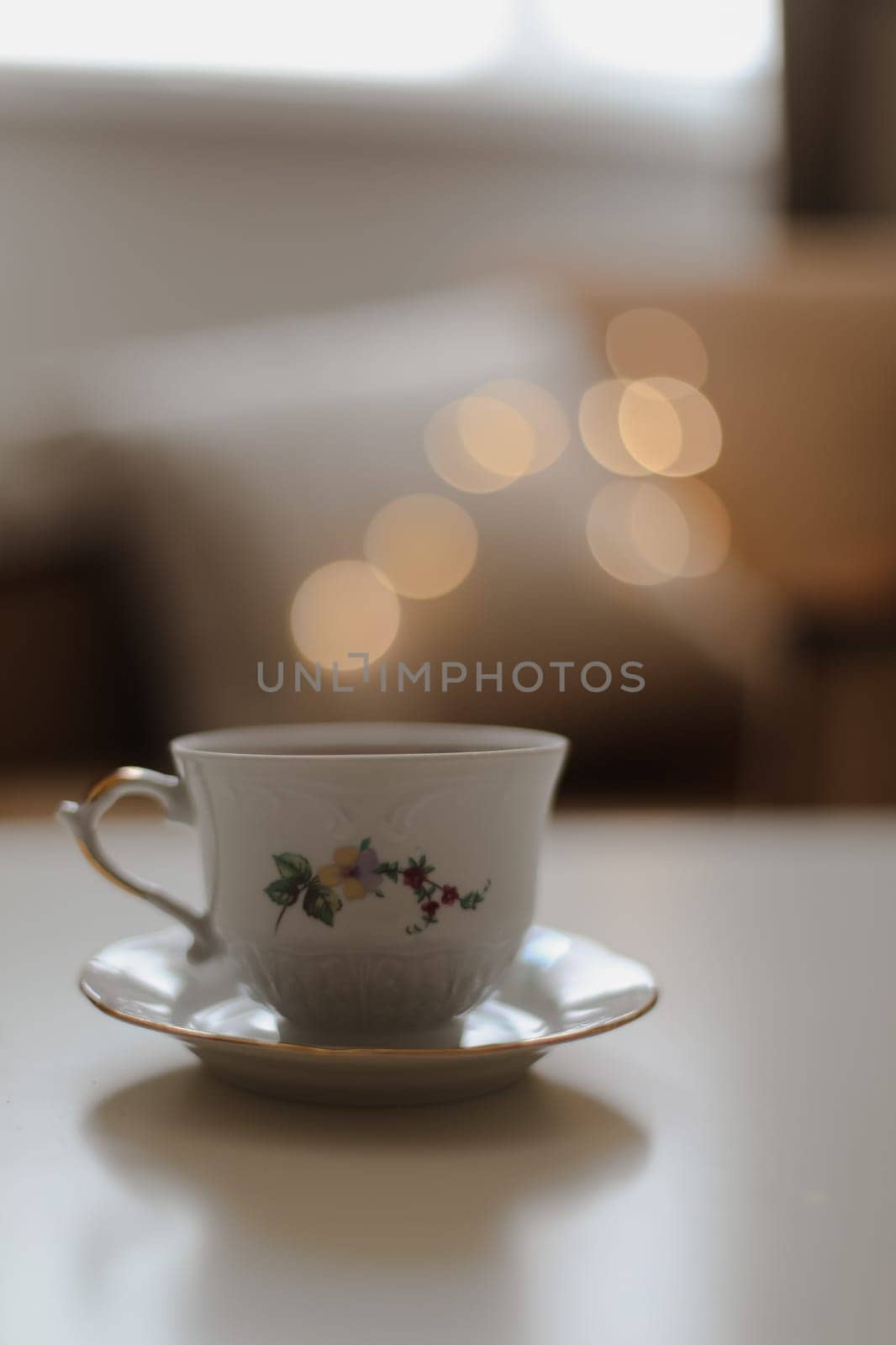 coffee cup on the table with blur background - soft focus, vintage style color effect