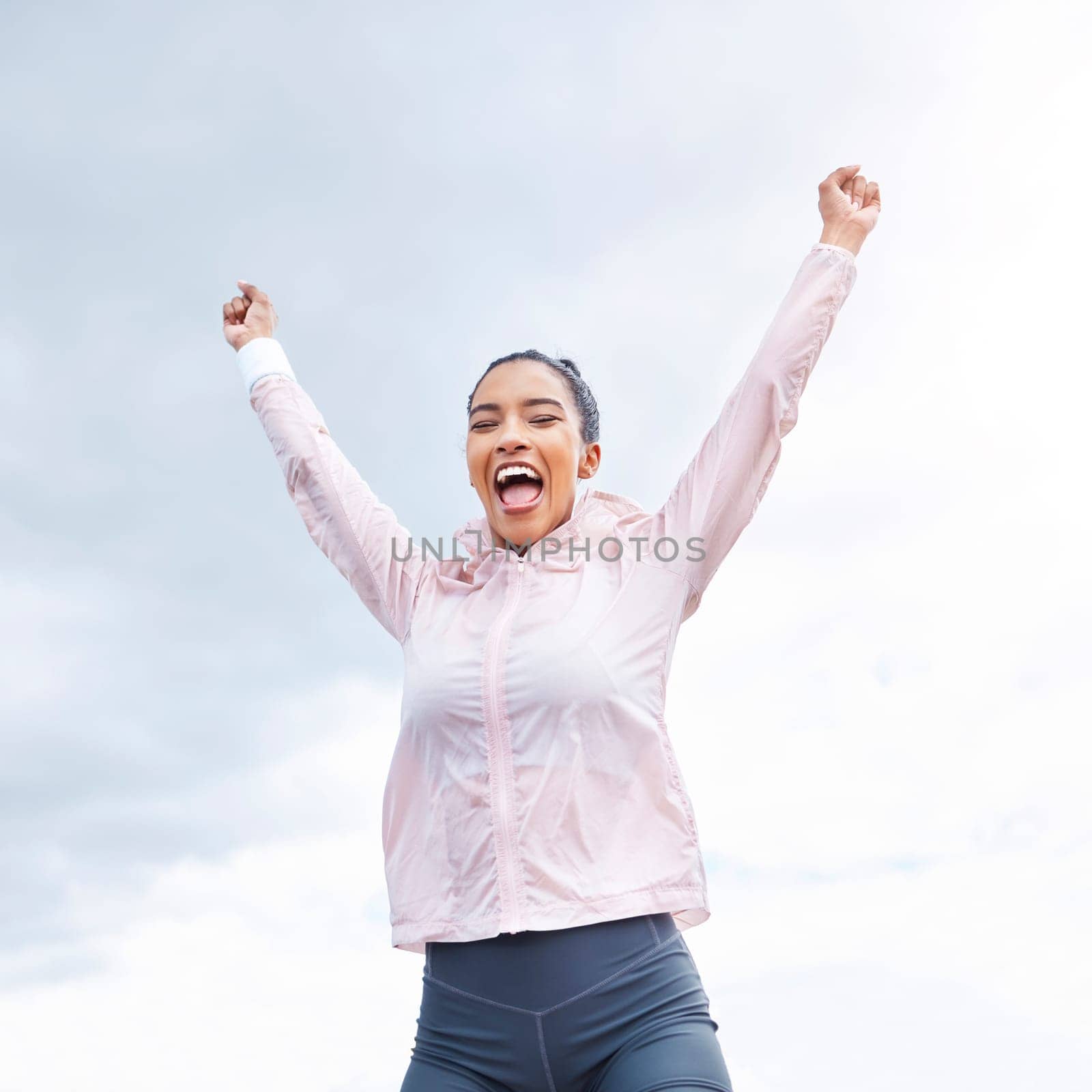 Happy woman, fitness success and achievement, freedom and motivation of goals, hope and wellness on sky background. Smile sports female arms up for celebration, winner pride and inspiration outdoors.