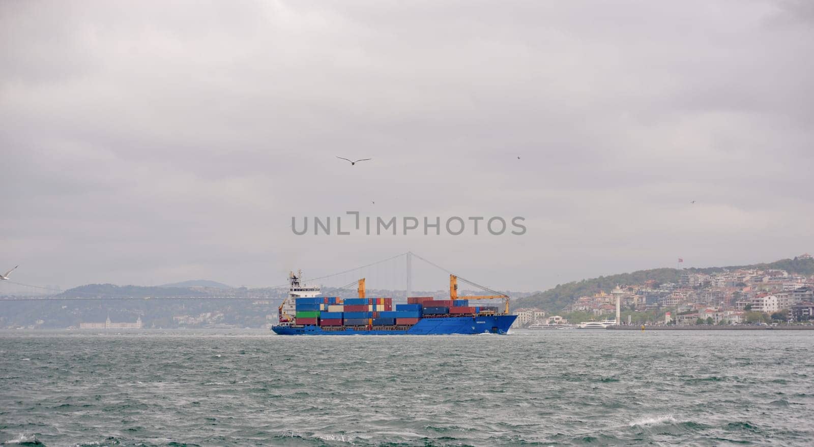 Istanbul, Turkey, May 02, 2023: Cargo ships pass through the Bosphorus, Istanbul