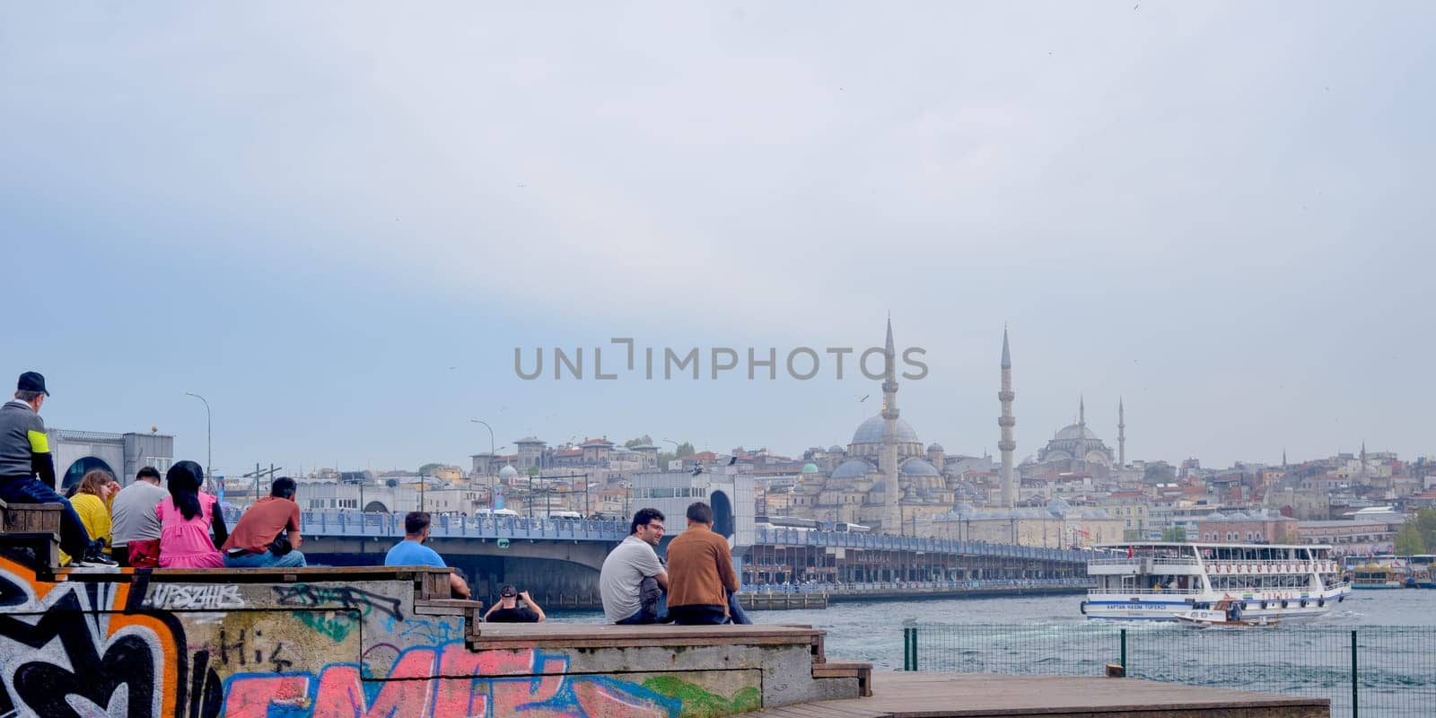 Istanbul, Turkey, May 02, 2023: The Golden Horn Embankment in the historical center of Istanbul with a view of the Suleymaniye Mosque and the Galata Bridge.