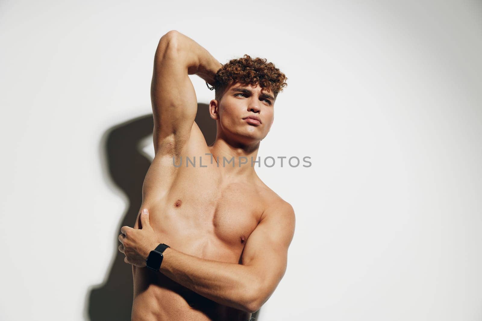 man handsome bodybuilder fit standing muscular athlete studio attractive muscle white background male shirtless gray background beauty body model