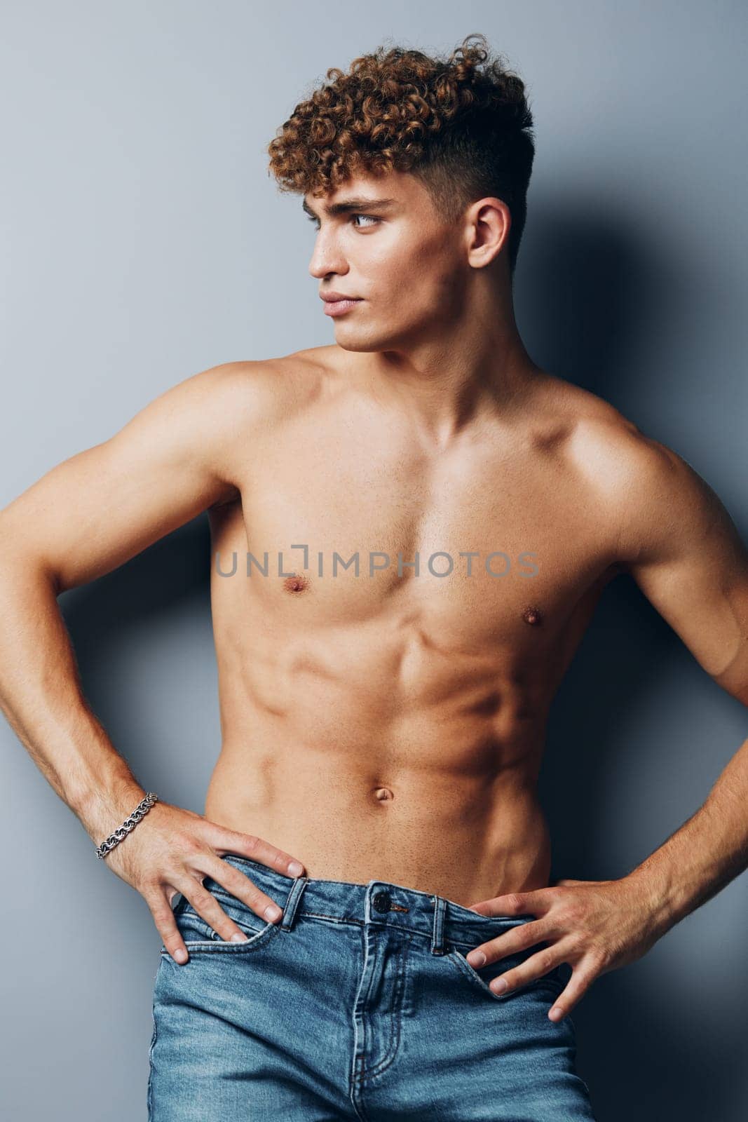 man studio abs muscular model beauty shirtless male handsome jeans smile fit body standing muscle fashion athlete healthy