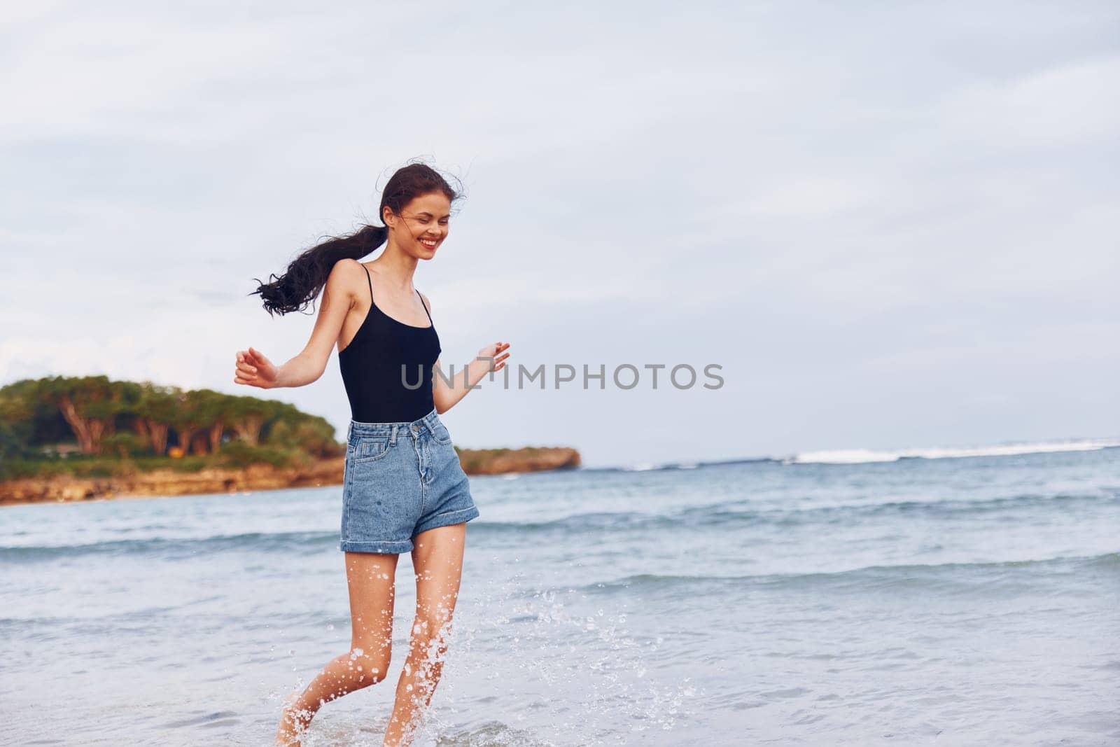 sunset woman young beach smile lifestyle beautiful summer running sea travel by SHOTPRIME