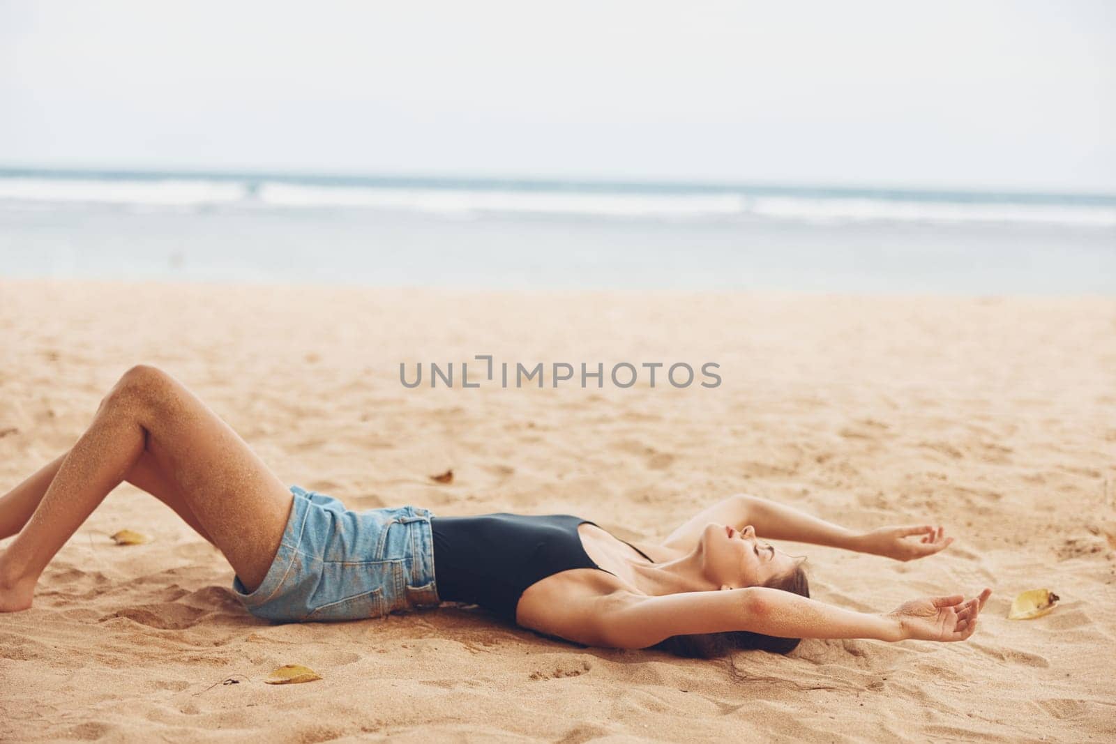 woman beach sitting travel vacation sea sand tropical smile freedom nature by SHOTPRIME